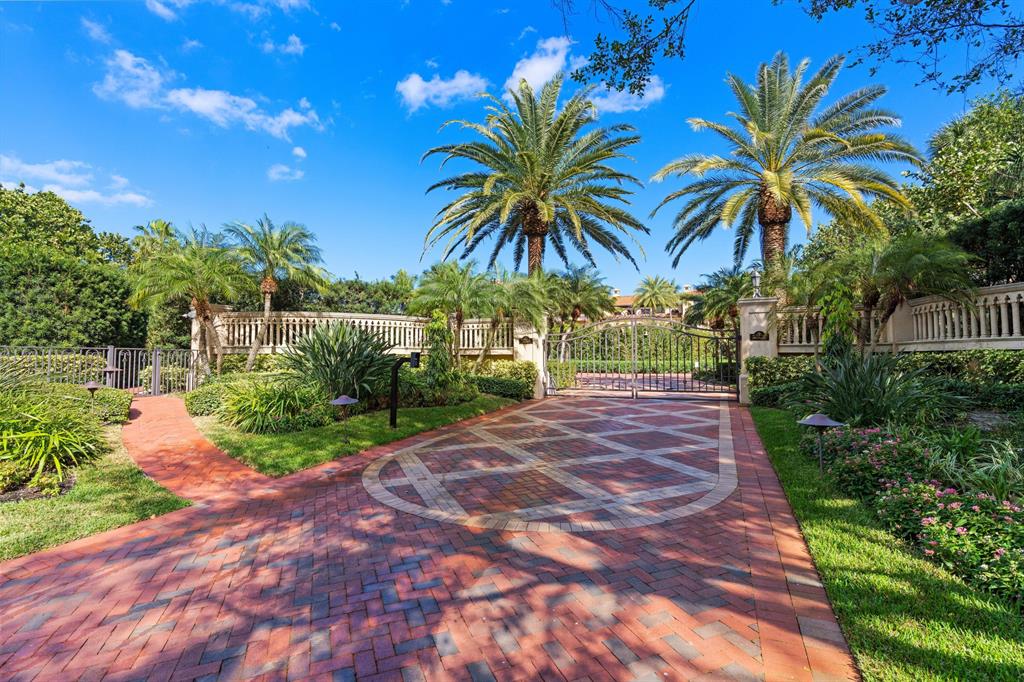 Nestled on a secluded stretch of Seminole beach and lining the azure waters of the Atlantic ocean stands one of South Florida's most prestigious oceanfront estates, Bel Viaggio.  Boasting 190+/- ft. of ocean frontage and situated on approx. 2.9+/- acres of land this custom 9 bedroom 12 full and 4 half bath estate is tucked away in the North Palm Beach neighborhood of Seminole Landing, one of the only private gated oceanfront communities.Artful thought and design went into every space of this seamless 18,000+/- floorplan of living sq. ft. maximizing the stunning ocean views and immaculate grounds. Curated by architect and Palm Beach preservationist, Gene Pandula, interior designer Ray Clark and master landscape architect, Howard Ostrout Jr. this oceanfront residence offers unparalleled beau