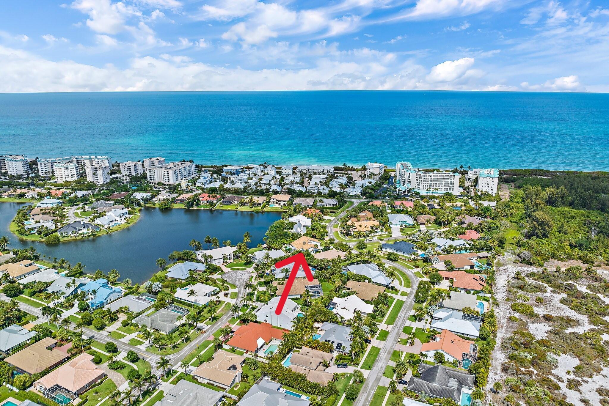 This modern fully renovated smart home on the lake in the community of Olympus is a rare gem. The house boasts large bedrooms, formal living and dining rooms, fireplace, impact windows, bamboo and tile floors! Step into the welcoming foyer to the formal living room with vaulted ceilings and a waterfall wall. The formal dining room is open to the living room and the kitchen. A full complement of top of the line appliances, and fully retractable impact windows looking out to the lake, heated pool, and lanai. Master suite is oversized with vaulted ceilings. Private yard with access to the water. Olympus is located near the beaches of Juno and Jupiter as well as great dining and shopping venues. This home offers a luxurious and comfortable living experience experience.