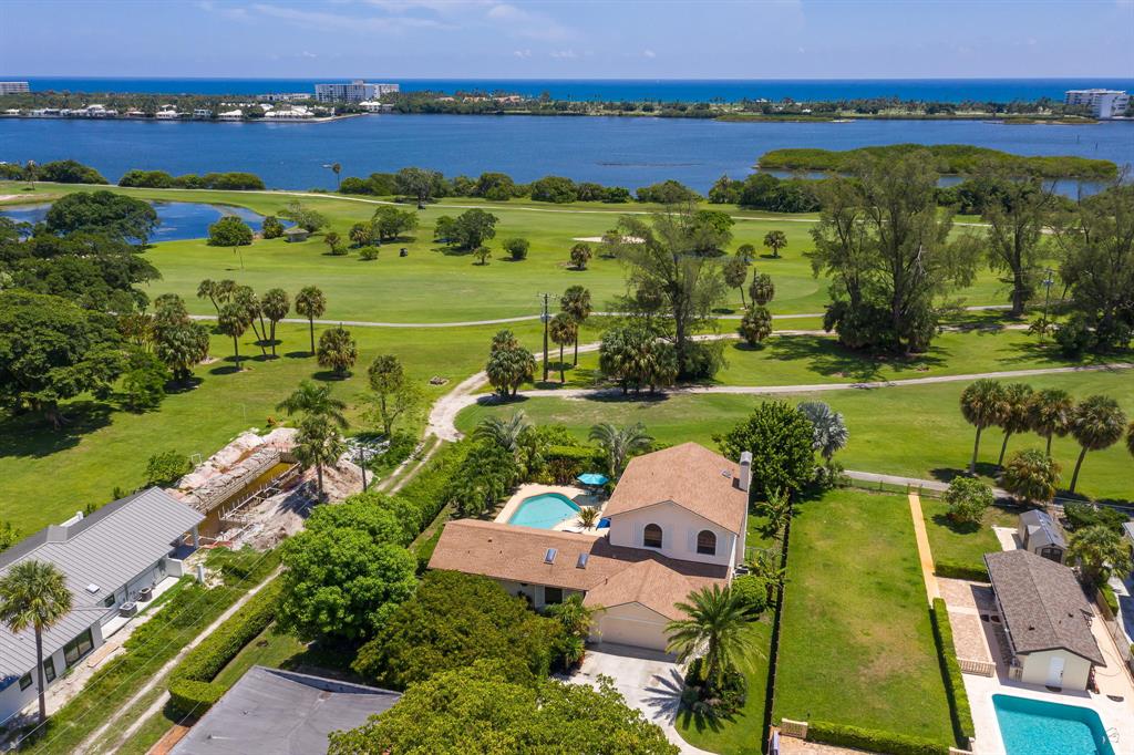 A triple master home with in-law suite awaits you in Lake Worth Beach! Enjoy this single family home overlooking the Fairway at Lake Worth Beach Golf Club with direct access onto the course and the intracoastal! Three bedrooms & five full baths plus sauna & a resort style heated pool. Third bedroom has its own private wing including wet bar and den, a perfect in-law/nanny suite, plus two bedrooms upstairs each with en-suite bathrooms. The living room, family/game room, dining room, and renovated kitchen make this home a dream for entertaining! Just steps off the intracoastal & a bike ride away from Lake Worth Beach with fabulous restaurants & entertainment.