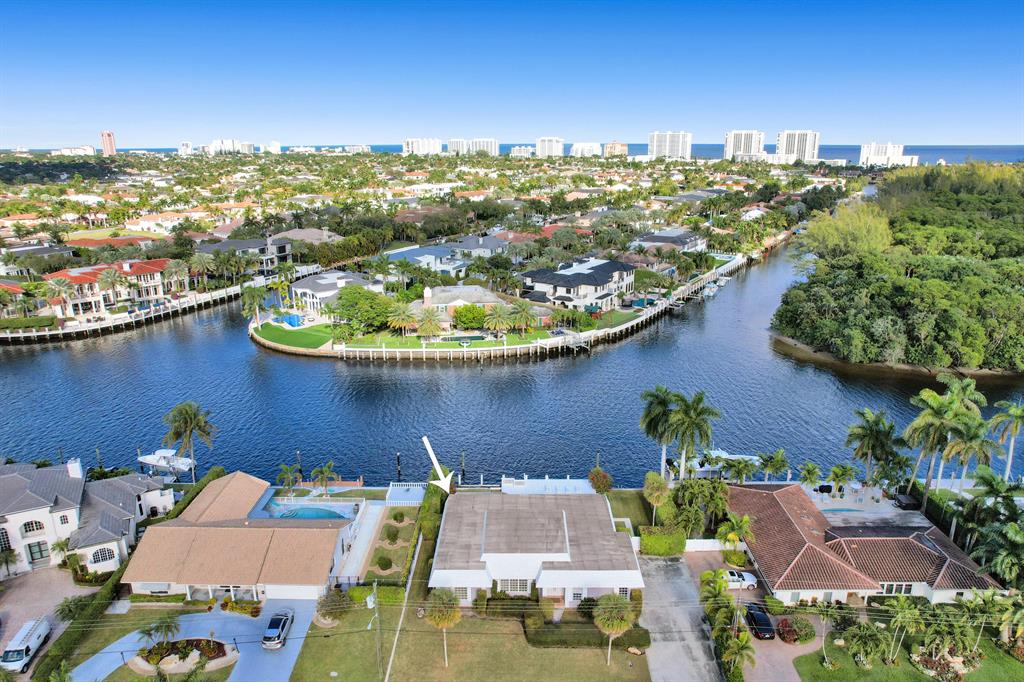 Incredible opportunity to own the most desirable lot in the highly sought after neighborhood of Little Harbor. With sweeping 180 degree water as well as nature preserve views of Deerfield Island, and straight across from renown Royal Palm Yacht and Country Club, this property impresses in every regard. The Hillsboro canal is more than 200 feet across at this location and with its no-wake zone perfect for the avid boater or yacht owner. Measuring approximately 100 feet on the water front and 110 feet in depth, this oversized lot is about 11,000 sqft  large, worthy of a spectacular, luxurious waterfront estate. The current home is a spacious 3 bedroom, 3 bathroom, split floorplan property with a large two car garage and pool, ideal to renovate or rent out during the planning process. Little Harbor is a beautiful gem of a neighborhood in the heart of East Deerfield Beach, just moments to shops, restaurants, the Intracoastal, award-winning beaches and downtown Boca Raton. With only 62 properties, many of them affluent estate homes, and only one entry point into the community, the neighborhood impressed with its privacy, tranquility and luxurious flair.