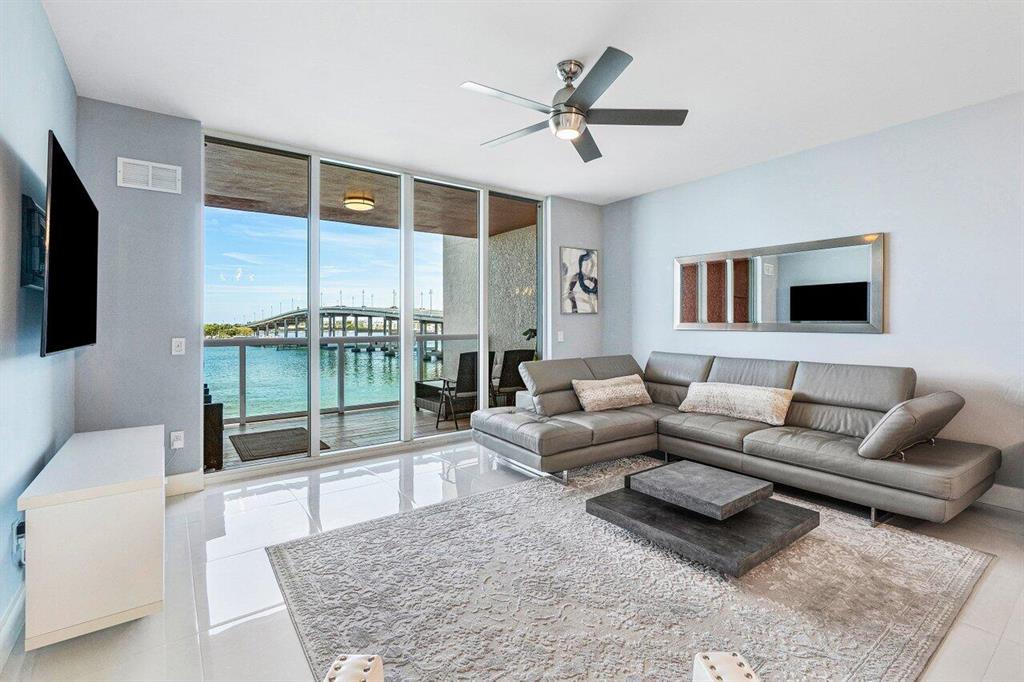 Updated 4th floor 2BR/2.5BA overlooking the Intracoastal, impact glass, semi-private elevator access. Open concept, split floor plan. Remodeled marble kitchen w/glass tile backsplash, remodeled baths. Spacious owners suite w/his & her walk-in closets. Primary bath w/double vanity, jetted bath & water closet. Assigned garage parking & climate-controlled storage unit. 24/7 manned gate, valet, tennis, pickleball, walking path w/gazebo, covered rooftop oasis w/pool, spa, BBQ areas, clubhouse, billiard room & fitness center. Marina w/dry docks available. Jump on your boat effortlessly & be on the ocean in minutes; no fixed bridges! Pet friendly. Minutes to nationally ranked snorkeling/diving at Blue Heron Bridge. Mgt can update re waterproofing project detail