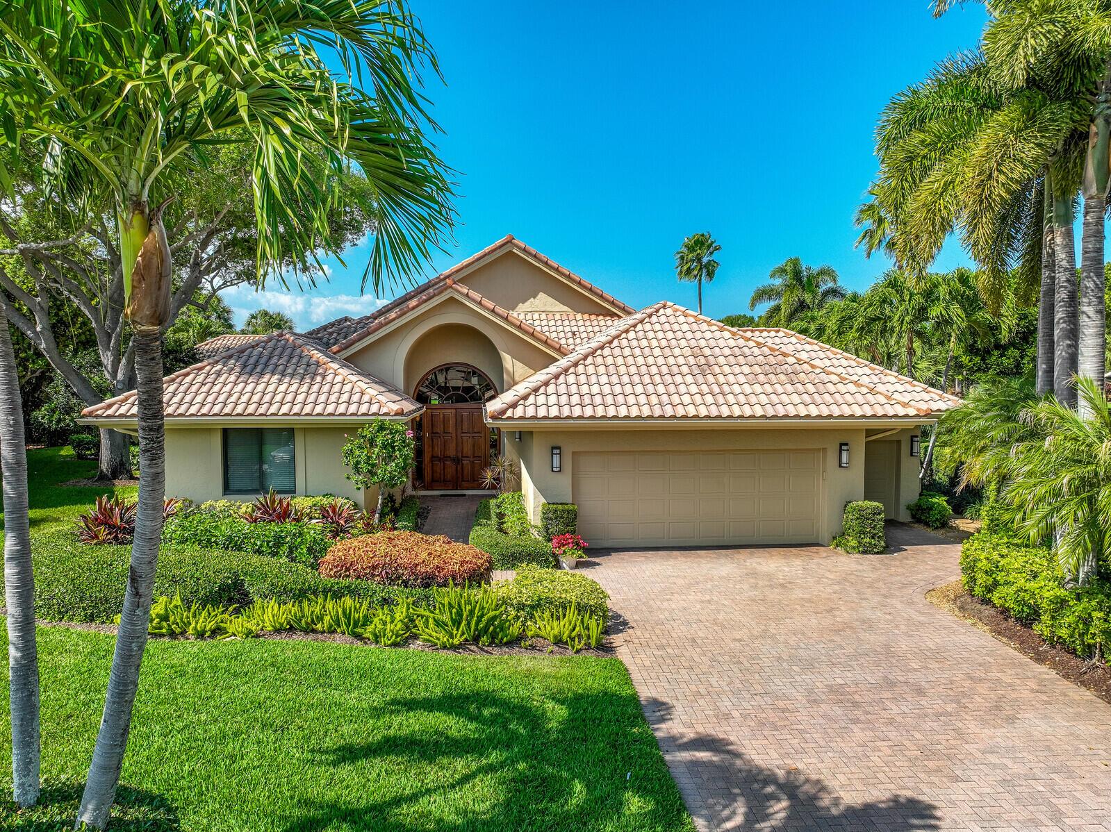 Situated on an oversized pie-shaped lot along a quiet cul-de-sac in Frenchman's Creek, this elegant, modern-style home offers stunning, serene, & lushly expansive views of the golf course as well as maximal privacy for the homeowner. This beautiful home features an open floor plan with soaring ceiling heights & abundant natural light. The interior space consists of 4  bedrooms, 4.5 baths, an office/den, gourmet kitchen with a large island & custom designed granite wet bar. The large primary suite and  sitting area are set at the end of a long gallery hallway to maximize quiet and privacy. The house includes impact windows and an inviting outdoor living space surrounded by professionally designed tropical landscaping & heated pool. This home is perfect for entertaining and is move-in ready.