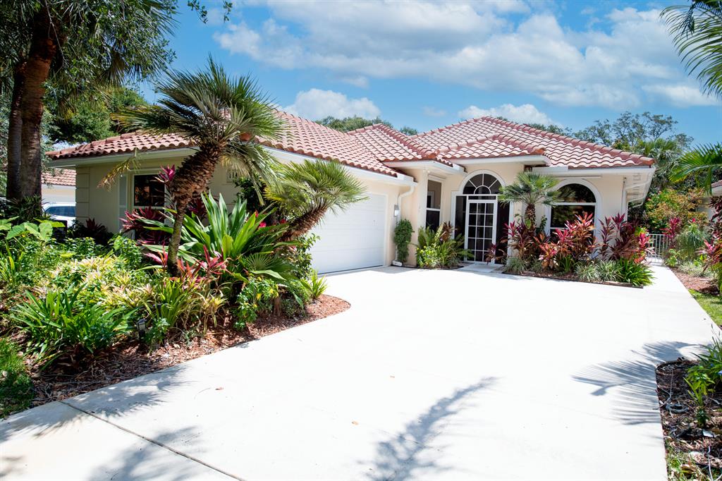 See this one NOW! This Bedford Model shows outstandingly well. Located in the community of Oak East in the center of Palm Beach Gardens!. All ages! Newer roof, newer a/c, Newer appliances and newer Hot water heater. DeVosta built has great floorplan, soaring ceilings and built ins in the closets. Screened Patio and front foyer too. Lush plantings fill the back yard with charm and load of privacy.  PBG has great shopping and not too far from beaches.  Easy to see and ready for your personal touch.