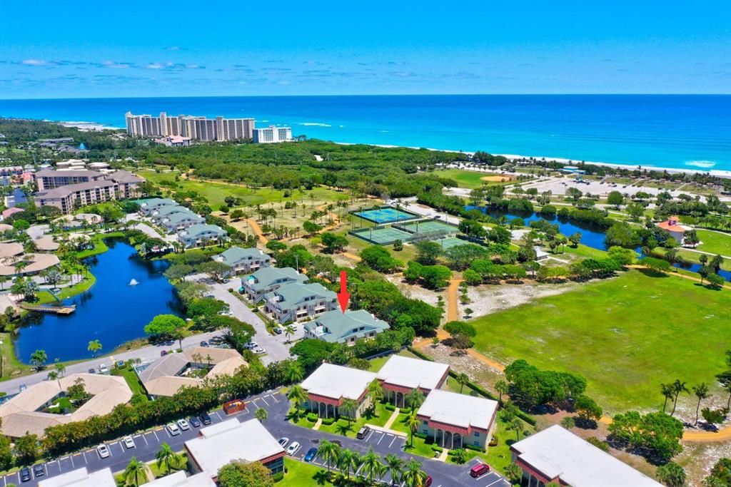 Located East of US1, this corner property is situated adjacent to the lush and beautifully maintained Carlin Park in Jupiter. This desirable first floor condo is almost an Equal Distance from the Community Pool as from the pristine Jupiter Beach. To add to the ideal location, the Community has minimal rental restrictions which makes this property an excellent investment. The property has been lovingly maintained with the AC and Water Heater units being less than 4 years young. Spacious patios are perfect for stargazing, al-fresco dining and enjoying the Ocean Breeze. Surrounded by Nature Conservancy protected beaches and parks, and steps away from glamorous restaurants and Island flavor Tiki Bars, this 2 bedroom 2 bath property is a perfect full time or part time residence.