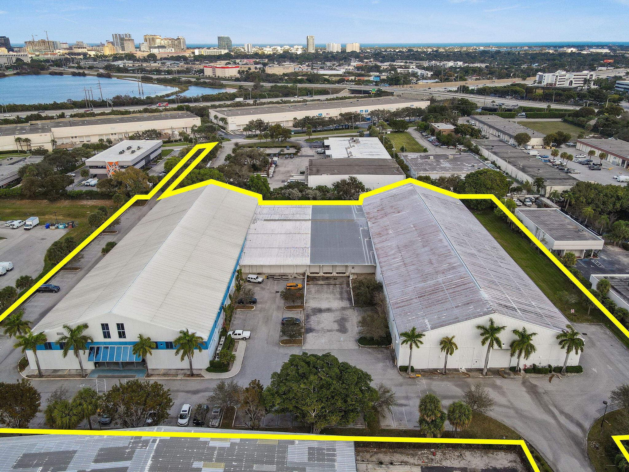 Pleased to present the iconic ''Palm Beach Ice Works'' property for sale. This unique and expansive industrial property is strategically located in the highly sought-after City of West Palm Beach, just minutes from Palm Beach International Airport (PBI) and I-95, providing easy transportation access and accessibility for distribution throughout Florida. This property spans across two buildings and offers a unique combination of features that make it a prime investment or owner user opportunity. 1590 N Florida Mango Road - approx. 54,340 sqft currently built out as a world class skating rink  1600 N Florida Mango Road - approx. 46,547 sqft vacant column-free warehouse with dock high loading