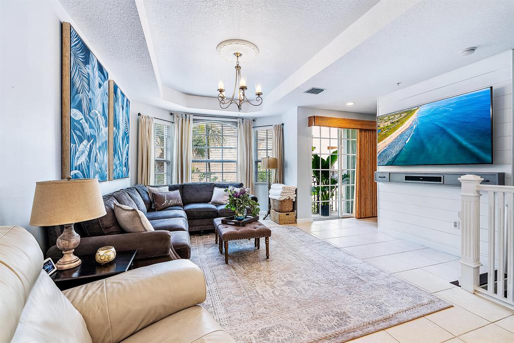You will LOVE this coastal townhouse in the private gated community of Harbour Oaks! Located approximately 1/2 mile from Trader Joes, Whole Foods, Lifetime Fitness, the Gardens Mall, and the Intracoastal Waterways, it doesn't get any better! This home has an updated kitchen and powder bath, real hardwood floors, mostly impact windows, shiplap walls, and some recent appliance upgrades. There is a separate first floor office with a full bathroom, which could easily become a 3rd ensuite bedroom. This community features a lakefront community pool, fitness center, comprehensive HOA package, and is pet friendly! Come see it today!