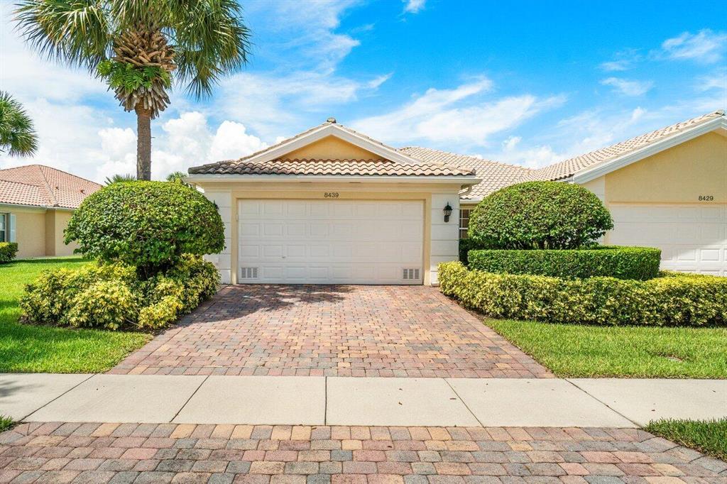  Immaculate EXTENDED CAPRI III Model. 2 Bedroom, 2 Baths, 2 Car Garage villa with water views of the lake in highly sought after community of VillageWalk! Open Kitchen boasts; 42" cabinets, GRANITE countertops with full backsplash, white appliances, soft close cabinets w/ pull out drawers and large peninsula island for additional seating. Additional features: split bedrooms floor plan, porcelain TILE throughout, 6 panel doors, PLANTATION SHUTTERS, vaulted ceilings, CENTRAL VACUMM system, crown molding, recessed lighting, solar tube for natural light, formal living area and family/dining area, large laundry room w/ laundry tub, cabinets and additional storage. Large Master suite offers walk in closet, floating dual sink vanity with pullout drawers, linen closet and shower/tub combo with glass enclosure. Complete hurricane panel SHUTTERS. Paver walk way and driveway, A/C (2014). Expanded screened-in patio w/ pavers is perfect for relaxation and entertainment! Sold Furnished! HOA covers exterior paintings, roof cleaning, lawn services, irrigation, alarm monitoring, internet, and premium cable for 2 TV's. Community is filled w/amenities, events, clubs, manned gate, fitness center, playground, 2 pools (lap/main), Tennis courts, Basketball, Bocce Courts, mail room, hair &amp; nail salon and cafe. Centrally located to Wellington Mall, restaurants and schools.