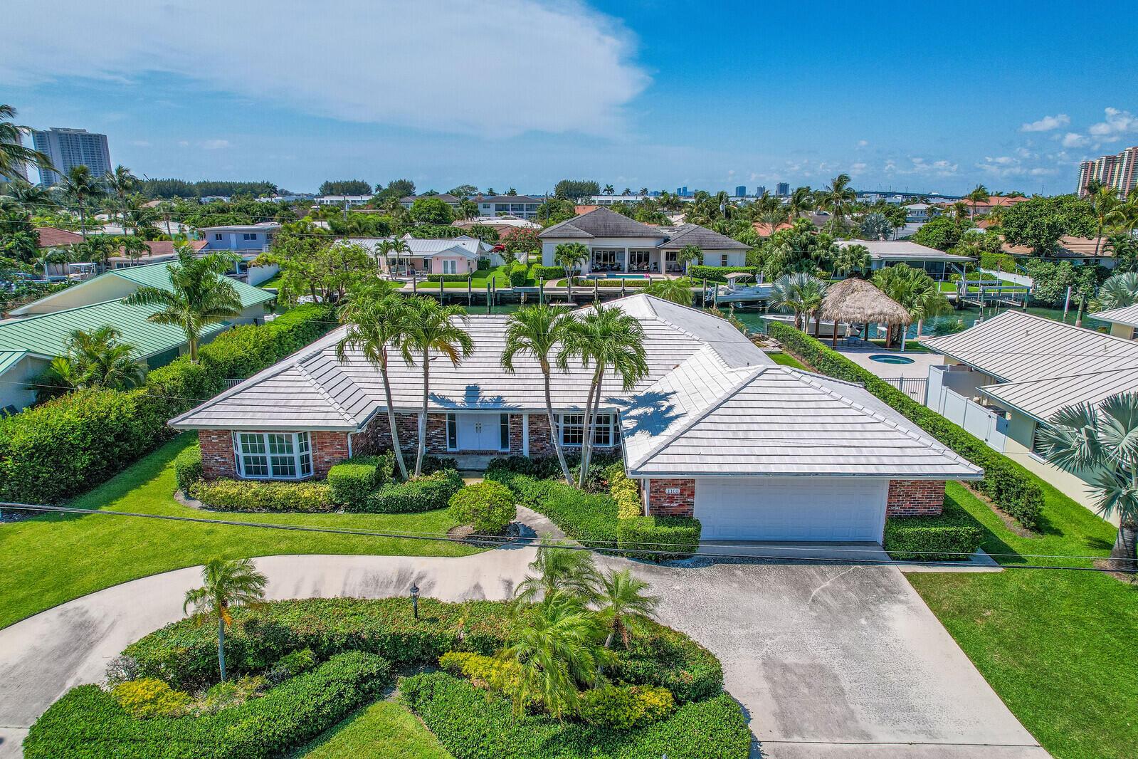 DO NOT miss this rare opportunity! Prime waterfront location on beautiful Singer Island offering 100 feet of water frontage on the best deep water canal on Singer Island as well as a lot depth of 131 feet, making it one of the largest lots in the area, and the highly sought-after southern exposure for your pool and back yard enjoyment. Located 9 homes in from the Intercoastal waterway this location provides easy access to Lake Worth Inlet and NO fixed bridges. A NEW vinyl sheathing seawall with cap is fully contracted with deposit in place and awaiting materials. The expected completion of seawall is Fall of 2023 and is included in the sale price. The existing home was built in 1972 with 2809 square feet under air and a large 715 square foot finished rear porch and is ready for your