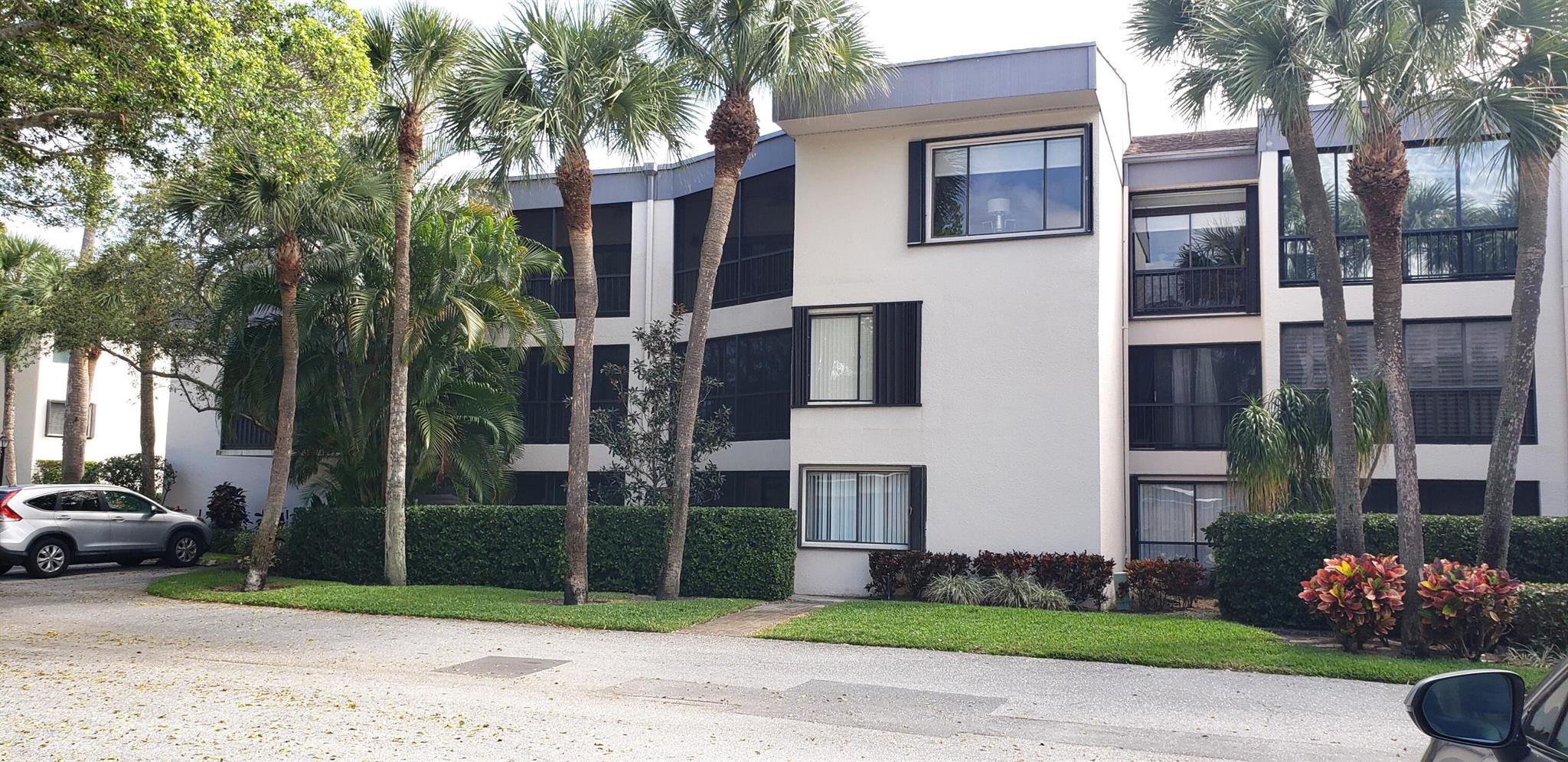 Large and spacious 2/2 condo with boat slips and intracoastal views on premises. Newly renovated kitchen and 2 separate balconies. Updated bathrooms. Brand new water heater and a/c 2014. Hurricane shutters, and full-size washer/dryer. Lots of storage space. NOT a waterfront condo. Boat slips have a waiting list. A walk away from your front door. Must reside in the community to purchase or rent. 24-hour guard gate, close to great restaurants and premier shopping. Beaches 1 mile away. Owner can rent immediately if so desired. Tennis court, and 2 pools. There is a storage unit deeded with the condo. Waterfront on opposite side of the building.