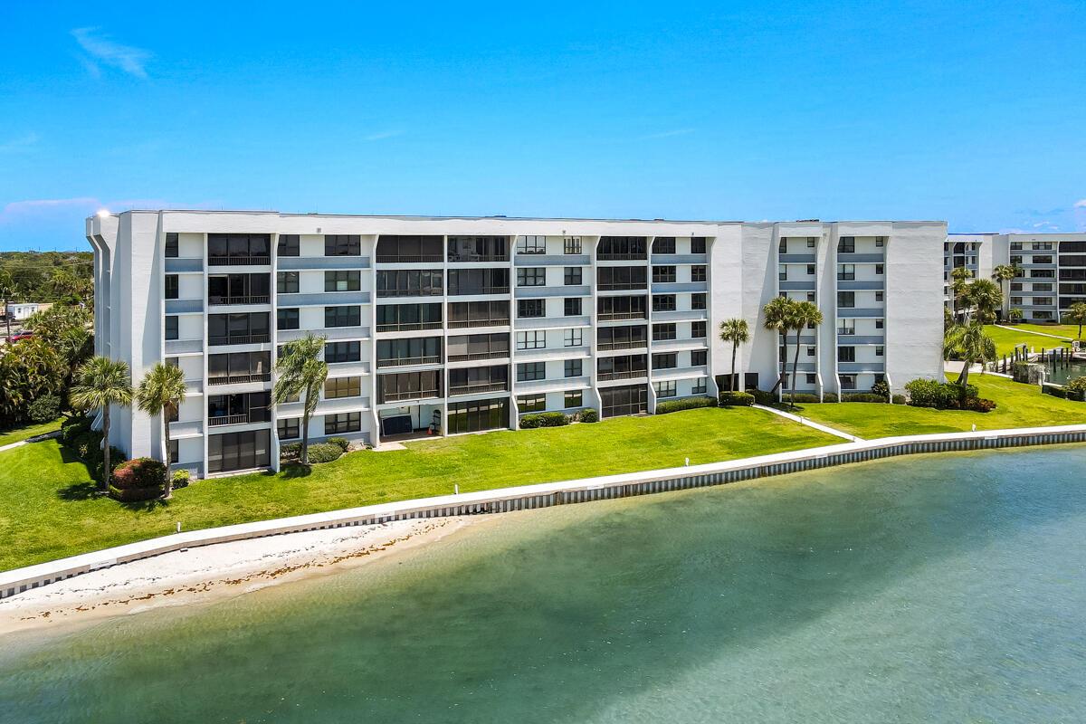 Amazing views from this 5th floor unit with views from most every room.  Blue water tides, ocean & river, sunrise & sunsets. Watch the dolphins and turtles swim by. The best waterfront community in Jupiter. Split bedroom plan. This unit was updated a couple of years ago and is ready to move right in. Wood flooring throughout, impact windows and accordion shutters. 40' dock spot available for purchase see broker remarks. Gated entry, carport parking with storage, plus extra storage on 5th floor, tennis and community pool.