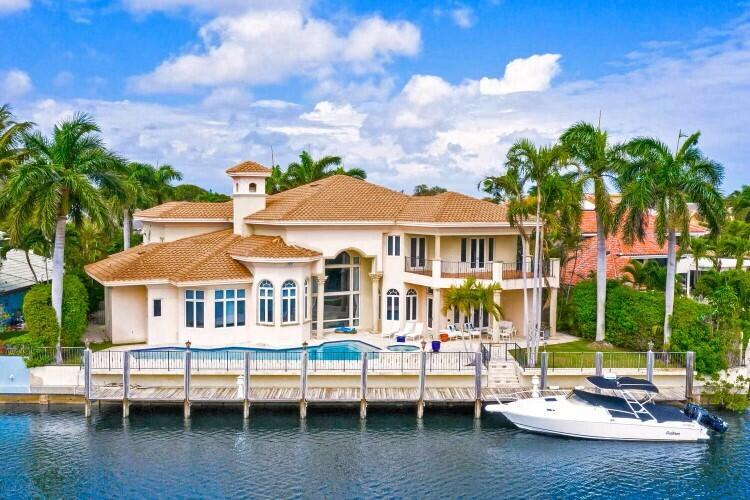 Nestled in The Sanctuary, renowned by Forbes as one of America's most prestigious ultra-luxury gated communities, 4900 Sanctuary Lane is sited on a Prized Waterfront lot within this 27-acre bird and wildlife sanctuary. With 130 feet of waterfront & unrivaled sweeping Southeast water views, this Exceptional Residence can accommodate a Mega Yacht & offers a Compelling Waterfront Value in a private domain reserved for discerning owners seeking privacy, security, and the highest echelon of luxurious living. Boasting over 8,000 sq ft of living space, this Deepwater Estate features 5 Bedrooms, 7 full baths, 2 half baths, a main level Primary Bedroom Suite w/ separate Baths & Dressing Rooms, an Office/Library, & a Secondary Bedroom Suite on the first level, formal Living and Dining rooms ... The second level offers 3 additional bedrooms ensuites, a gym, and an expansive Clubroom w/ a generous balcony overlooking the waterway that beckons unforgettable entertaining experiences.  A 50' Resort-styled pool along the waterfront w/ spa, lanai and Whole House Generator, 2016 New Roof, 4-Car Garage are also part of the value offering.  The Sanctuary offers 24-hour manned security gates, roving security patrols on land and water, as well as a amenities such as tennis courts, a playground, full basketball court, and a 20-slip marina.  Just minutes to The Boca Raton, a world-class Resort &amp; Spa, as well as extraordinary dining, shopping and the Boca Raton executive airport. Don't miss your chance to own a piece of paradise in The Sanctuary. Discover the epitome of luxury living, where architectural excellence meets natural beauty, and indulge in a lifestyle reserved for the privileged few.