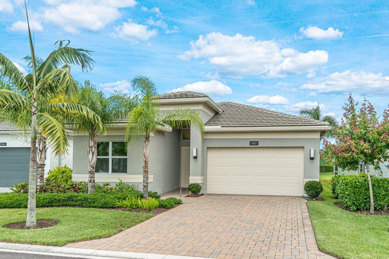 Elegant Ruby model features 2 bedrooms plus a den, 2 full baths and a private backyard with beautiful lake view. Upgrade highlights include impact windows, whole house generator, Bosch kitchen appliances with natural gas range, upgraded lighting and fixtures throughout, tons of LED hi hats, whole house gutters, epoxy garage floor, and so much more. Clubhouse features full service restaurant, tennis, pickle ball, 39,000 square foot clubhouse, indoor/outdoor bar and more.