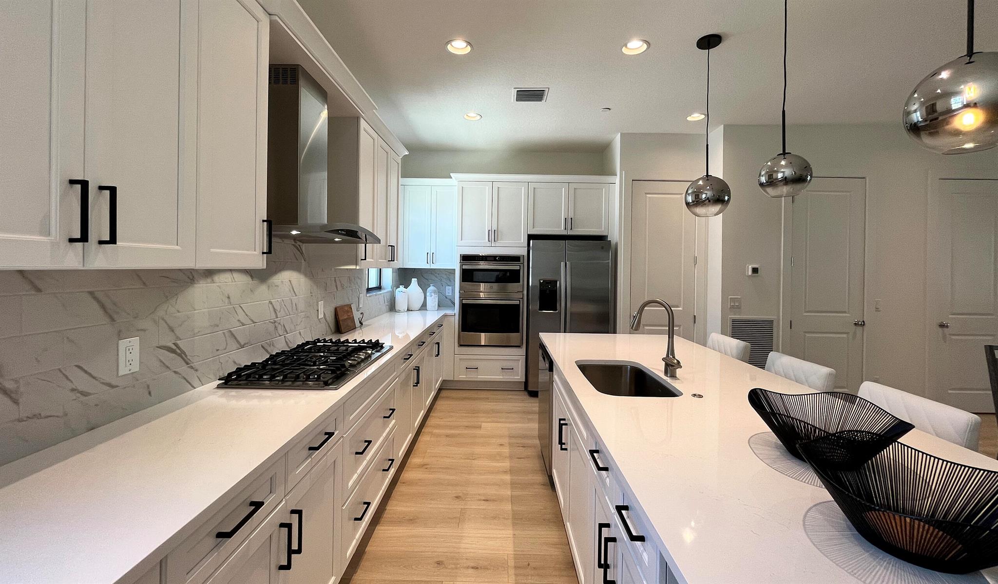 **NEW CONSTRUCTION AVAILABLE DECEMBER 2023** Townhome featuring 3 Bedroom, Den, 3 full and 1 half bath, and a 2-car garage. The Great Room on the second floor has access to a covered balcony, allowing for outdoor living. The Kitchen was thoughtfully designed with white cabinets with crown moulding, 30'' built-in combination wall oven and microwave, 36'' wall-mounted hood, and a 36'' cooktop GE profile. All main living areas feature tile flooring.The Owner's Suite is complete with a frameless walk-in shower, dual vanity, and two walk-in closets.