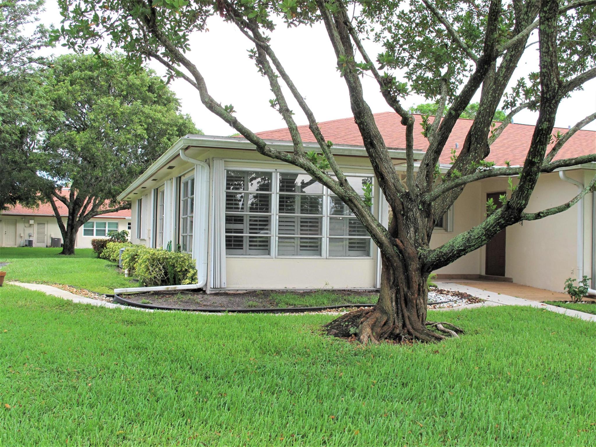 Great location of this remodeled 2BR/2BA corner villa nestled in a 55+ community. Villa features: Accordion shutters on all windows,  Plantation shutters on inside windows, raised floor Florida room under air, maple cabinets in kitchen w/granite counters, SS appliances, garbage disposal, AC 2012/2013 compressor 2007, Crown molding, no popcorn ceilings are smooth, knock down walls, 4 ceiling fans, New shower stalls in both bathrooms, new bathroom vanities w/granite counters, raised panel doors, pull down stairs for attic access, 18x18 neutral tile throughout, neutral carpeting in master bedroom, exterior rain gutters, custom building patio in back yard and custom installed walkway from parking area. New buyers may rent after 2 yrs then only once per year 3-month min. Not a pet friendly community, but medical necessity allowed w/proper documentation. Enjoy Florida living at its best in this very active 55+ community where you'll enjoy many planned social activities, game night, traveling, newly renovated fitness gym, large, heated resort style pool and clubhouse and so much more. Located close to all amenities, just minutes to the beach and downtown Delray where you'll discover quaint shops, open-air cafes, fine restaurants, shopping malls, theater, close to I95/Turnpike and Places of worship. You'll find a coin operated washer and dryer in each building of 4 units. 

 **All information is deemed reliable but not guaranteed and subject to change without notice. **