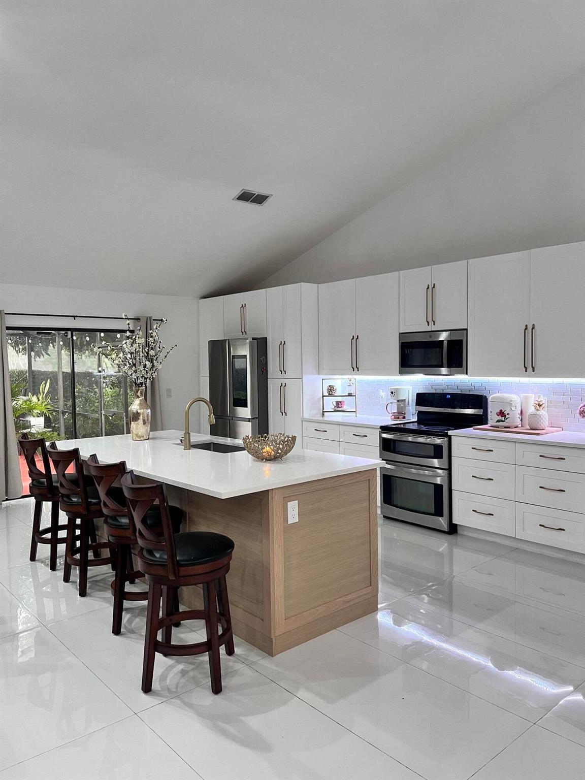 WELCOME HOME! Check off every item on your wish list in this lovely 4 bed 3 bath home located in the desirable Winston Park community in Coconut Creek and featuring easy proximity to local shopping, dining, recreation, entertainment and major thoroughfares. Everything has been remodeled from porcelain tiled floor throughout living areas  updated fixtures. Remodeled and Updated Spacious kitchen with  Dining area offers plenty of cabinet and counter space.  Owner's suite features an in suite bath with double-sink. Enclosed beautiful pool, open deck and privacy fence backyard is perfect for outdoor entertaining. Easy access to the Turnpike and Sawgrass Expressway. Low HOA Ready to Move In Today!