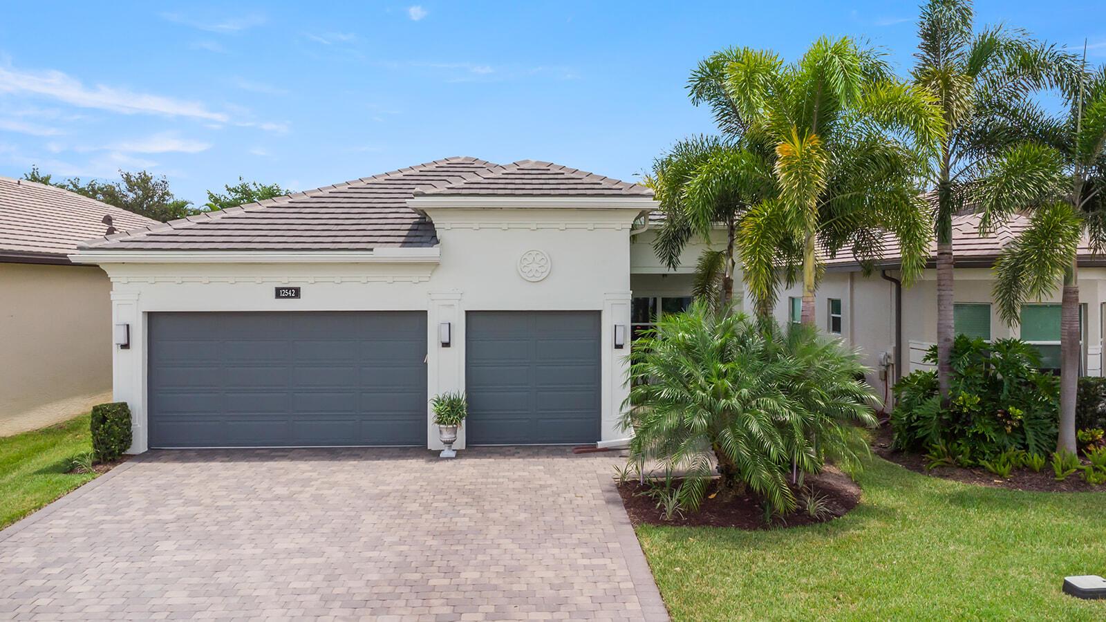 Experience contemporary elegance in Valencia Bay, Boynton Beach. This 3-bed, 3-bath, 2,147 sqft home, built in 2019, features a 3-car garage with electronic charging, hurricane-impact windows and doors, custom-designed cabinets, granite counters, double oven, abundant storage, and over $100k in upgrades. There's also an office/4th bedroom option depending on your preference. Enjoy the extended/screened patio for ample hosting and relaxation. Join the vibrant 55+ community with artistic classes, fitness facilities, a resort-style pool, 24-hour secure gatehouse, aerobics studio, grand ballroom, tennis (clay courts), pickle/bocce/basketball/handball, and an on-site cafe. Live the dream! Property has a huge safe that will convey.