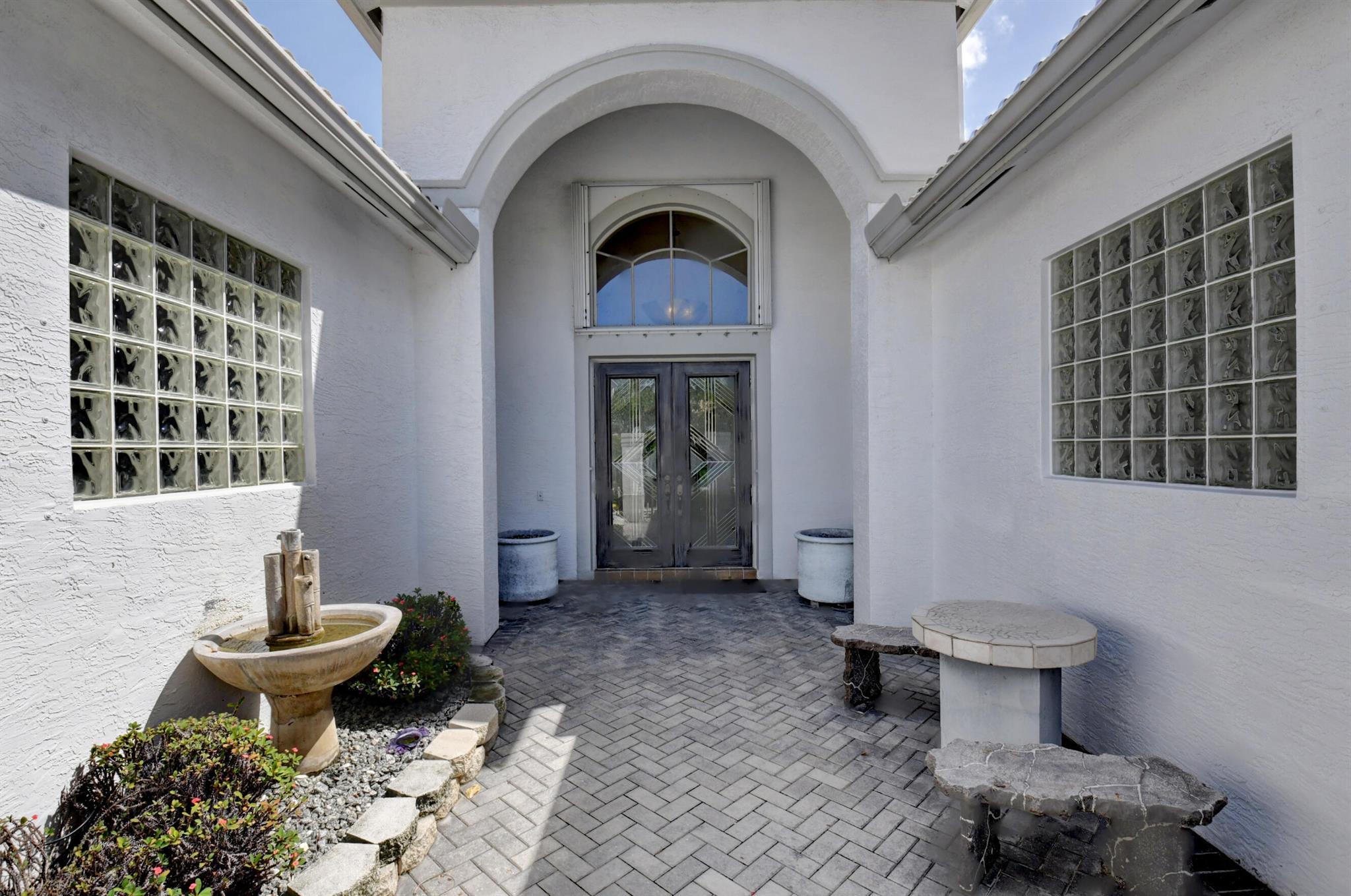 Absolutely Stunning Contemporary Open Concept Elegant Home; 3 bedroom, 2.5 bathrooms with heated pool and amazing enclosed glass patio. It has all what you would want and desire in a 24 hour manned gated 55+ retirement community.  Move in ready and enjoy the sun this winter. Furniture negotiable. Valencia Palms has all the amenities you would want of a country club without the costs.