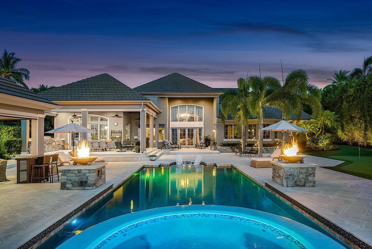 Indulge in waterfront luxury at this French-inspired masterpiece in Admirals Cove. Seamlessly blending traditional elegance with modern sophistication, this single-story haven exceeds expectations. With cutting-edge technology, including a Vantage lighting system and integrated sound, every detail enhances the ambiance. The dream kitchen boasts top-of-the-line appliances, while the backyard oasis offers a pool, spa, and captivating flame burning urns. Additional features include an office, guest house, and media room. Meticulous attention to detail and exquisite craftsmanship are evident throughout. Experience the opulence of this home in person and embrace refined luxury. Welcome home.Indulge in the epitome of luxury living with this unparalleled waterfront residence situated Amazing Home Features
*Single Story
*Admirals Cove Intracoastal Canal
*95 ft Water frontage with a boat lift
*Bldg Area: 9,312 sf Living Area: 6,454sf
*Total Lot Size: 30,185 sf
*4 Bedrooms including a Guest House
*4 Full Bathrooms/ 3 Half Bathroom
*5 car garage Including golf cart
*Media Room with adjacent Bar with 10 seats, 110 inch screen and
powder room
*Chef's Kitchen: Subzero refrigerator, Thermador gas stove with
double oven, Large kitchen island with second sink, 3 dishwashers
*Bar with commercial ice maker
*Wine Refrigerator holds 325 bottles of wine
*Catering kitchen in the garage that has oven, microwave,
refrigerator and dishwasher
*2 sets of washer and dryers
*Substantially sized Master Suite with sitting area, elaborate en-suite with double vanities, double bathrooms and the additional washer and dryer, an elaborate custom walk-in-closet with center island and large safe
*Crestron Electronic and Vantage Lighting and Sound system
*Whole house back-up generator
*3 On-demand hot water tanks
*Office with custom shelves
*Formal dining area
*2 different living areas off the kitchen
*Decorative gas fireplace

Backyard Oasis
*Scenic Water Views
*Heated Pool with Sun Shelf And Spa
*Decorative Gas flame urns
*3 separate covered sitting areas
*Outside cabana Fireplace, Service Bar , TV, powder room, outside
shower
*Outdoor built-in grill
*Putting Green
*Dock with boat lift
*Expansive open space