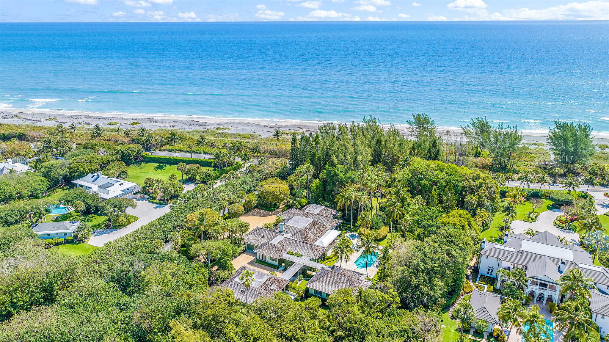 Completely private, furnished oceanfront main house with two guesthouses totaling  of 6 bedrooms, each with an ensuite bathroom on 3 acres. Newly resurfaced pool and spa. Deeded beach.