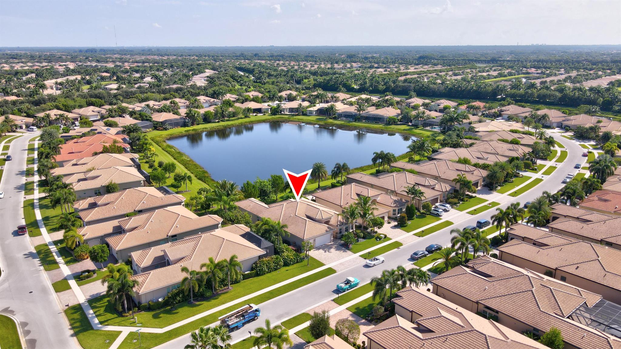 Rarely available ''Charleston Grande'' model with over $160K in Upgrades! Situated on a Builder's Premium Lakeview lot in the prestigious Capri section. This is the largest floor plan in the community, and it sits on the largest lake. Featuring 3 Bedrooms, 3 Full Bathrooms, expansive Formal Dining room, Club room, Living room and 3CG with epoxy flooring. Open Arch to Clubroom has been reconstructed with two French doors so it can be closed off as an office or 4th bedroom. Upgrades include Impact windows, Newly painted Interior, Coffered ceilings, Italian imported 24x24 inch ceramic tile flooring throughout entire home, Hunter Douglas Window Treatments, Designer light fixtures & 52 LED hi-hats. Granite kitchen features Stainless appliances including Double oven & 42'' Refrigerator, custom Maple cabinetry with full granite backsplash, Center Island, Snack bar and separate Breakfast area. The master suite boasts a coffered ceiling, two walk-in closets and an upgraded Granite bath. In addition to the widened pavered driveway &amp; entry walkway, the extended screened and pavered patio, the 2 car garage bay has been extended. Maintenance is $2014.00 paid per quarter and includes lawn, alarm monitoring, manned gate, cable package, internet, and amenities. Valencia Cove is a premier 55+ lifestyle community featuring a spectacular 39,000 square-foot clubhouse and 10-acre outdoor recreational facility. Endless activities, trips, shows, and clubs of all types. The clubhouse features an expansive foyer and lobby, grand ballroom with raised stage and dance floor, four spacious card rooms, Cafe with indoor/outdoor seating, Arts and crafts room with kiln, Internet/Billiards room, Office, Catering kitchen with separate demonstration cooking studio, Yoga &amp; exercise studio with ping pong, fully equipped fitness center and men's and women's locker rooms with steam rooms, massage room and showers. There are 4 pools - a beautiful Resort-style pool and Shade Pavilions, Lap pool with Swimmers' Lap Lanes, Resistance walking pool, Grandchildren's wading pool, and an Outdoor whirlpool spa. There are 8 har-tru tennis courts with shade pavilions and lighting for night play, tennis pro shop, tennis pro, league play, 4 pickleball courts with league play, 2 bocce courts, half-court basketball and walking/jogging/biking paths throughout and just outside the community. Valencia Cove is conveniently located near shopping, restaurants, houses of worship and major highways!