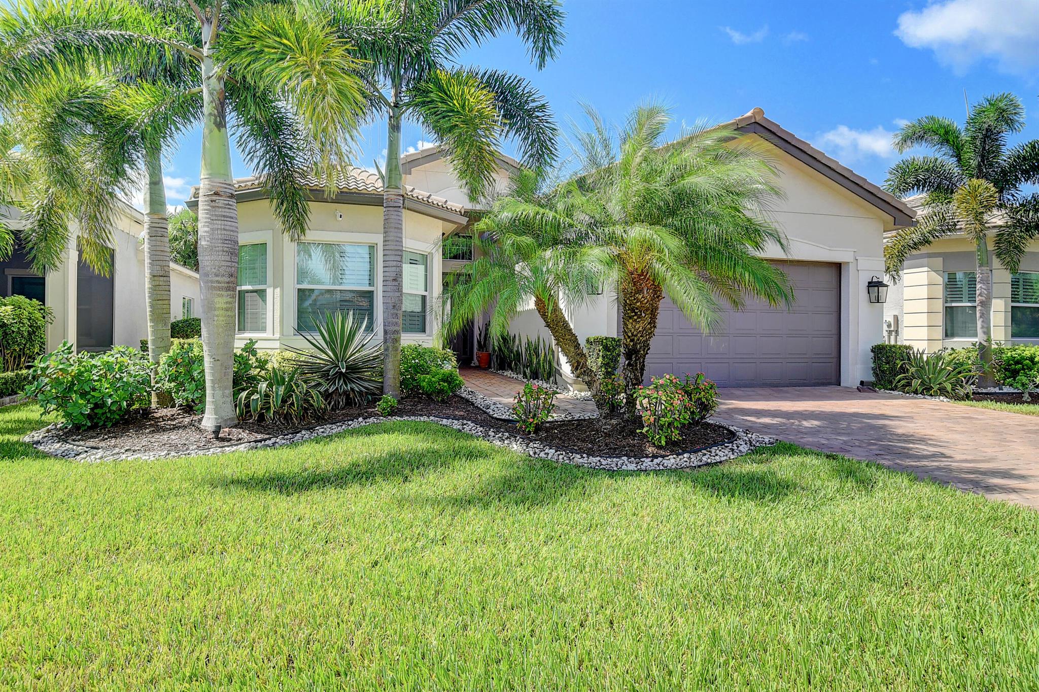 Immaculate! 3 BR's Plus Den, 3 Full Bathrooms.  If you want a very private and tranquil backyard, this is the one for you. Walking distance to clubhouse. Prewired for future pool w/heater. 24''x24'' mudset porcelain tiles, quartz countertop in kitchen, granite in baths. Numerous upgrades. Designer lighting throughout, plantation shutters throughout and Silhouette in Primary BR. Impact windows. Screened lanai and extended patio. Recessed lighting. Ceiling sound speakers in Great Room/Primary BR/Primary Bath & Lanai. Ceiling fans. Crown molding. Glass enclosures in all baths. Designer closets.  Upgraded A/C with 10 year warranty & Germicidal UV Light. ADT Smart Locks, Ring Cameras plus much more. See full list of upgrades. Move right in - it's all been done! Tennis & PB teams w/on site pros. This home is prewired for future pool with heater (60 amp sub panel and upgraded electric).  Valencia Bay has beautiful pools including the main pool, a resistance pool and child pool, 6 lit tennis courts, 6 lit pickleball courts 2 lit bocce courts, fitness center, cafe and beautiful Clubhouse with social rooms for cards and a large ballroom for events and shows.  Maintenance includes lawn maintenance, cable package, alarm monitoring by ADT and exterior house painting.  24 hour manned guard gate.  See attached document for full list of upgrades.