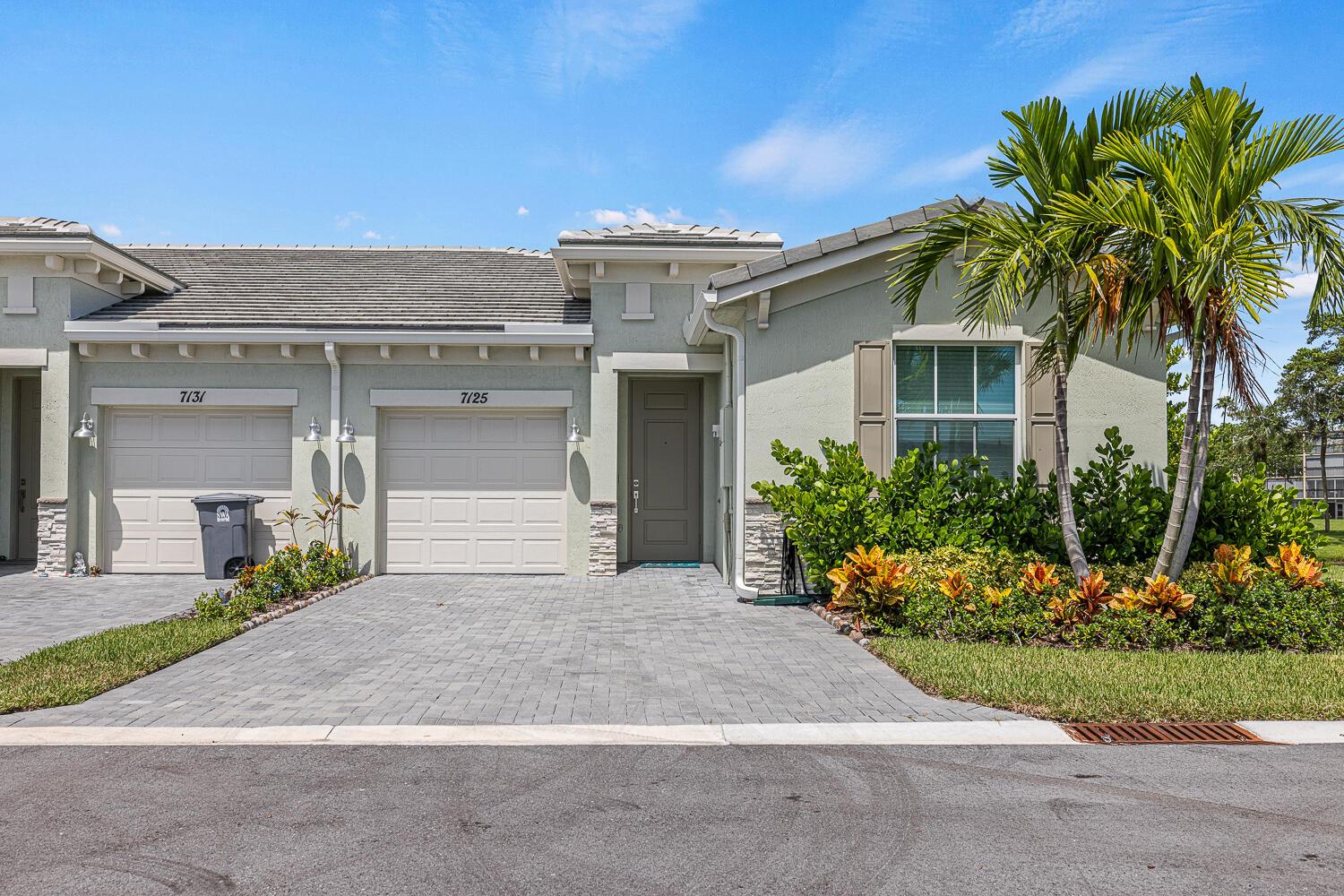 PRICE REDUCTION! The BEST 3 bed 2 bath END UNIT Townhome/villa in the community! Lake views galore and LOTS of green space on the end of the street! Almost Brand New construction located in the desirable Avalon Trails active adult community. This unit built in 2021 has only been used a couple of months and still has the new construction aroma. You'll find design details including LVT flooring, Kitchen features 42'' cabinets, pendant lighting, quartz countertops, and GE appliances, Honeywell smart thermostat and Ring security kit, complete impact windows, sliders, and front door. Covered rear patio with lake views and plenty of green space. Community features include resort-style clubhouse, pools, fitness studio, arts and crafts, game rooms, tennis, pickleball,theatre and onsite cafe