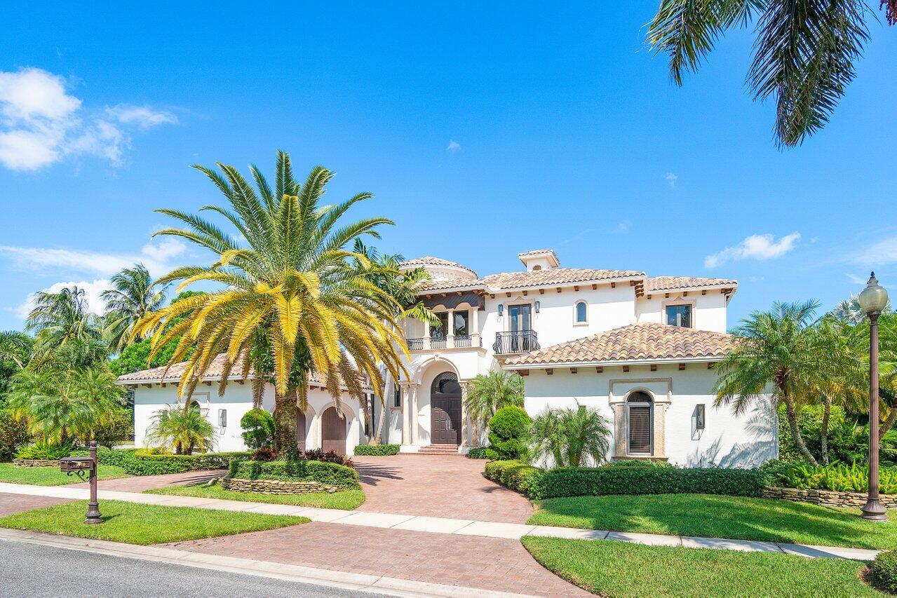 Sited on half an acre in one of Boca Raton's most coveted neighborhoods, The Oaks, this custom estate features 6,525 square feet, 6 ensuite bedrooms, 2 half baths, office and loft. Exquisite finishes and superb quality combined in gracious, light filled, open spaces all oriented to majestic views and ideal for indoor/outdoor living and entertaining. Sited on a quiet cul-de-sac this home will impress you upon arrival with its stately presence, perfectly manicured landscaping and 4 car garage. Breathtaking views and sight lines begin at the front door, which open to reveal a stunning and expansive foyer featuring 30 foot high ceilings, a grand staircase and an arched entry leading to the sun filled living room. The living room is the centerpiece of the main floor and features a bespoke fireplace and picture windows overlooking the stunning backyard and expansive lake views. Adjacent to the living room is a wet bar with venetian plaster walls and an elegant and airy dining room with two arched windows. The chef's kitchen is a study in culinary style, with beautiful custom cabinetry, quartz countertops, waterfall edging, a large island with prep sink, snack bar with counter seating, SubZero and Wolf appliances and walk in pantry. The kitchen opens to a spacious and serene family room and an oversized breakfast enclave with shiplap ceiling details. French doors open to the luxurious primary suite which feature his and her bathrooms, two dressing rooms with newly installed custom cabinetry by California Closets and a restful oversized bedroom. Completing the ground floor is a stunning office with built in desk, an en-suite guest room and two half baths. On the upper floor is a spacious loft with a Juliette balcony and four ensuite bedrooms of grand proportion, three of which have lake views, and all have walk in custom closets. The grounds of this impeccable residence are every bit as impressive as the home itself. Befitting an indoor/outdoor lifestyle of lavish entertaining this backyard offers a variety of options for sport, entertaining, lounging or simply taking in the stunning views with a lanai, open patio, pool with spa, expansive lawn and basketball court. This is an extraordinary property of great sophistication and style in a magnificent setting. Additional upgrades include new generator, 2 A/C units, water heater, pool heater and pump, mini fridge in bar, light fixtures, flooring, Ring Security Doorbell and Cameras Security System, new irrigation control system and freshly painted interior. Exclusions:Mirror in powder room and cabana bath.