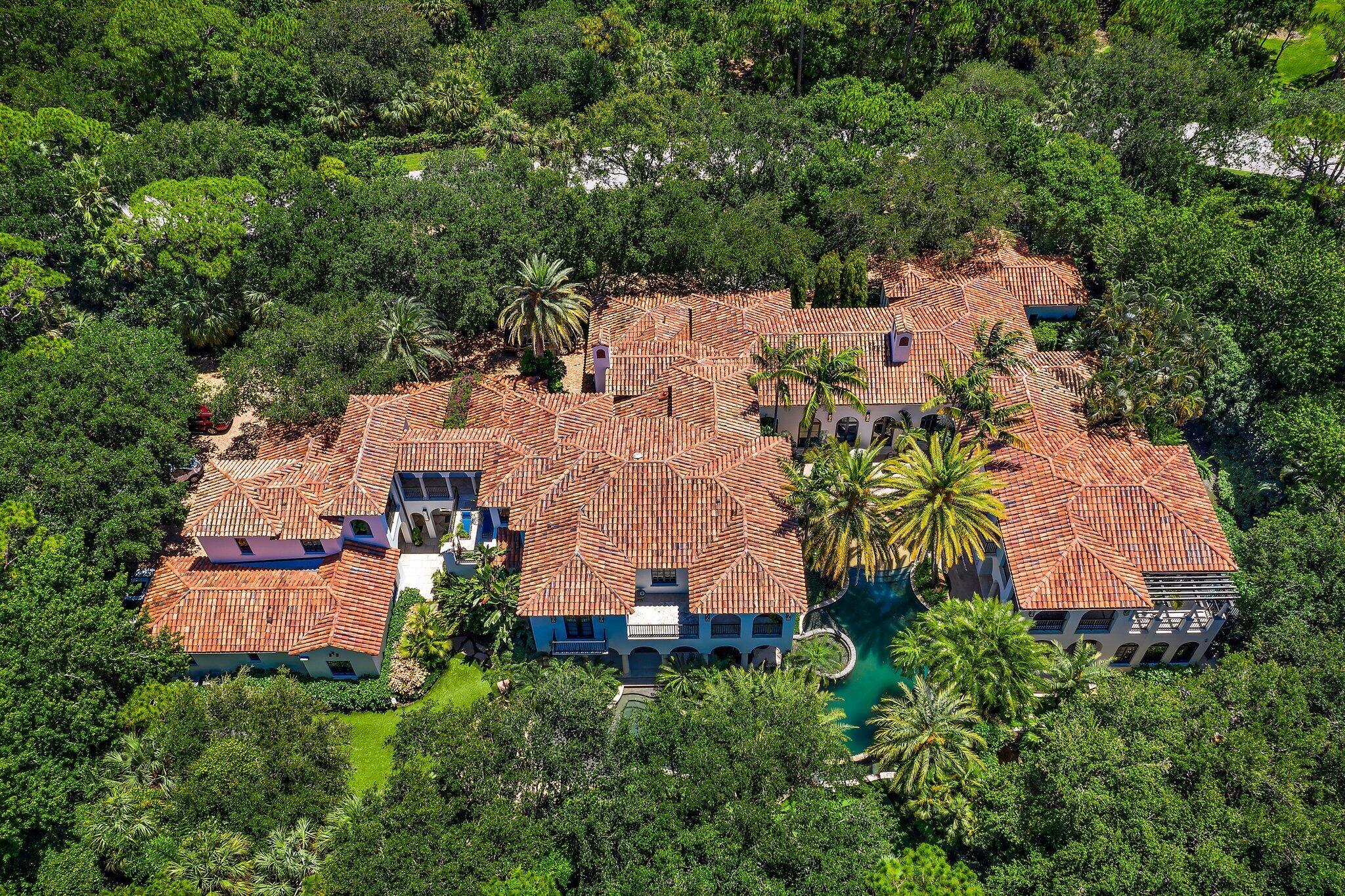 This sprawling Mediterranean Estate sits on 1.25 acres in the heart of The Bear's Club - an ultra exclusive enclave with only 48 estate homes on 369 acres in a park like setting. Renovated in 2019, this home includes amazing amenities like his/her offices; theatre; resort-style pool with grotto; putting green; and 9 garage spaces. Just minutes from the best shopping and dining in Jupiter or the PGA corridor, it's also less than a mile from the Atlantic Ocean.