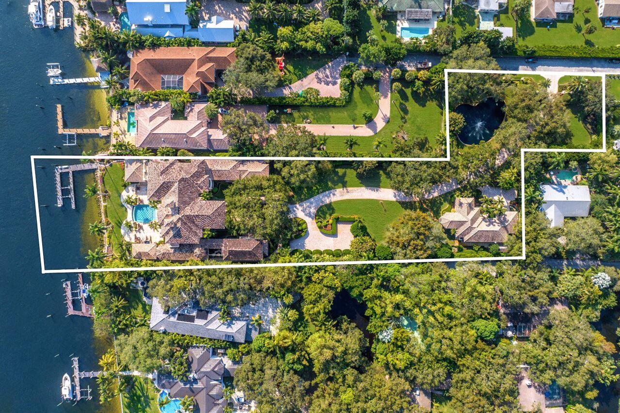 :Experience the ultimate in waterfront living with this majestic estate sprawling nearly 3 acres of direct intracoastal waterway in the heart of Palm Beach Gardens. Arguably one of the best locations, this compound boasts 150' of deep water intracoastal access, no-fixed bridges, and a no wake zone, all centrally positioned within minutes of the area's best restaurants, shopping, and highways. As you drive through the picturesque cobblestone brick driveway, you'll be welcomed by beautiful oaks, a pond, and a guest house throughout the grounds. Your private gated entrance provides an unmatched ambiance of security and privacy, unrivaled by any other property in the North End of the County Constructed in 2005, The Seven Oak's estate was built with the utmost quality and attention to detail. Built like a fortress, this impeccably designed compound boasts stem walls, poured concrete (1st &amp; 2nd floors), impact windows &amp; doors (Marvin made), a concrete hurricane safe room, 75KW generator, French drain systems, and much more!

Inside, the attention to detail continues with detailed custom woodwork throughout the home, imported Italian stone flooring &amp; custom doors, a true chef's kitchen complimented by a full-sized butler's kitchen, hair &amp; bone wood flooring in specific rooms, crestron system throughout, custom fireplace(s), natural gas, double oven wolf appliance packages, and so much more!

The spectacular master bedroom estate is one of the defining features of this estate, with a large sitting room, cozy fireplace, and two proper his/her bathrooms with two large his/her walk-in closets. Step outside onto the oversized covered balcony with beautiful tongue &amp; grove ceiling detail boasting eastern exposure views &amp; breezes of Palm Beach Gardens intracoastal waterway.

Other amenities include a large elevator, tankless hot water heaters, expansive summer kitchen, full cabana bath, full-size guest house &amp; movie theatre, custom infinite edge pool, dance studio, hair-salon, and expanded marble deck with two logia's.

This is a once in a lifetime opportunity to own one of Palm Beach County's most unique and desirable waterfront compounds! Live the luxurious waterfront lifestyle you've always dreamed of in this breathtaking estate.

Legal Description: 
SEVEN OAKS LT 3 &amp; TR A K/A WATER MGMT, 32-41-43, NLY 150.60 FT OF ELY 558.87 FT OF SE 1/4 LYG W OF &amp; ADJ TO FIND CNL R/W &amp; WLY 40.65 FT OF UPLAND PAR LYG E OF &amp; ADJ TO