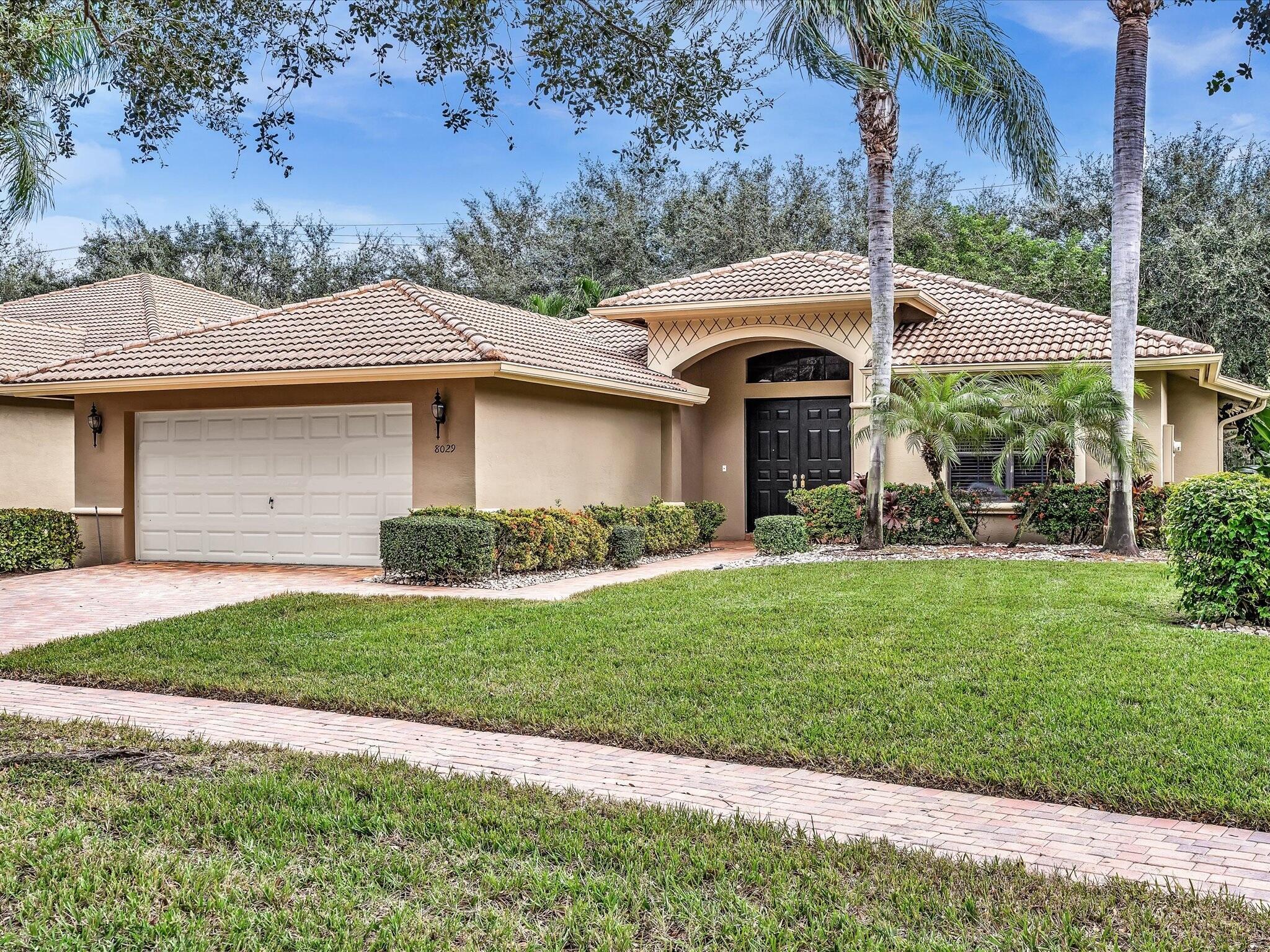 Presenting a beautiful 3/3 Venezia model located in Boynton's manned-gated community of Tivoli Reserve! This popular floor plan features a triple-split layout offering owners & guests complete privacy while providing an expansive Great Room thats centrally located and opens to a covered & screened brick paver patio. The home is situated on one of the communities full-sized private lots (not zero lot-line). Features include an upgraded eat-in Island kitchen with 42'' wood cabinetry, pull-outs & granite countertops, a large primary suite that includes two walk-In closets and an enormous bathroom with soaking tub, separate shower and his/hers countertops & sinks. Other upgrades include custom built-out closets, decorator window treatments & panel storm protection. Offered fully furnished.