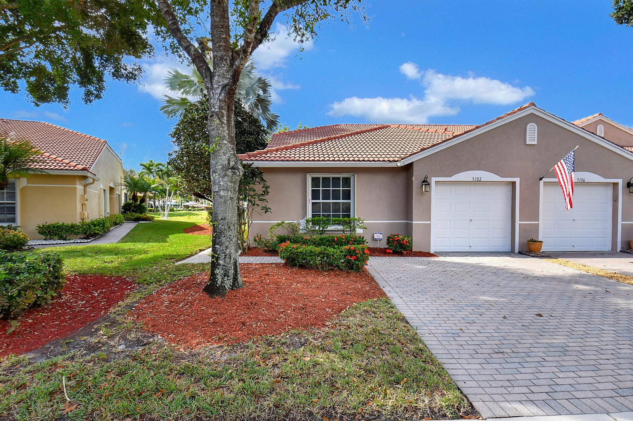 You have hit the trifecta with this one- Waterfront, Furnished, and Lifestyle! Beautiful long lake views, located right by the Clubhouse. This turnkey fully furnished, 3 bedroom 2 bath 1 car garage villa has a screened patio overlooking the the wide lake views and many many upgrades!  This active 55+ community features a clubhouse and so many amenities, enjoy shows and fitness classes. There is also a fantastic sports park with 3 pickleball, 6 tennis courts, bocce and putting green! This villa features tiled floors throughout, beautifully appointed kitchen with stainless and granite. The laundry features ''steam'' upgraded W/D.  There is a fenced yard for your fur babies! Being the most desired end unit, you get great natural light and fantastic views that interior units just don't offer.