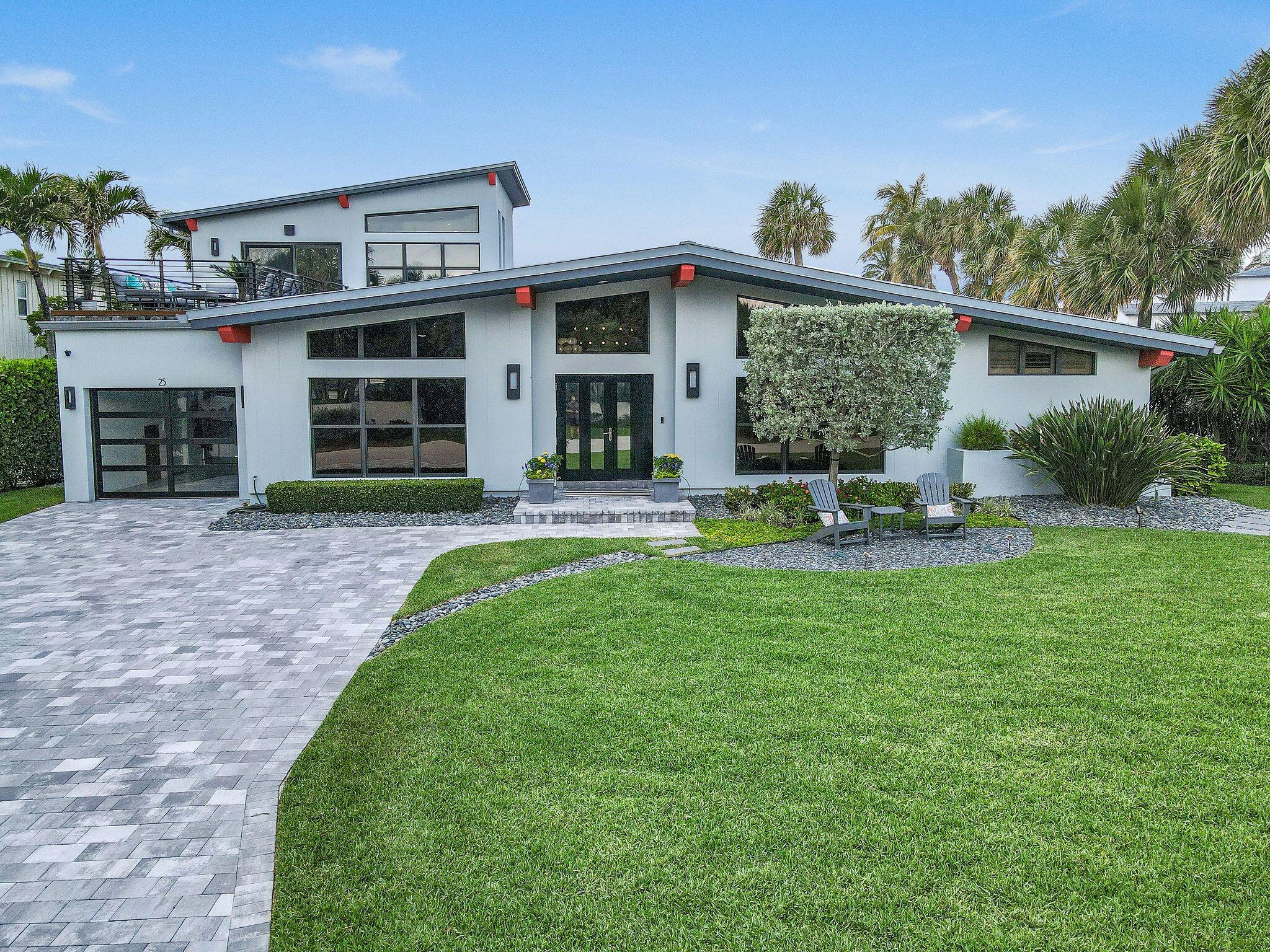 South facing, stunning natural light filled fully furnished 3BR/3BA with volume ceilings, custom lighting and all impact glass windows and much more. A must see. Located in highly desirable Jupiter Inlet Colony, This unique gem is located on a corner lot of the southern tip of Jupiter Island overlooking the Jupiter Inlet Beach Club's tennis courts and is a very short distance  to the south path to the beach The home has been meticulously maintained and many custom upgrades throughout the home. Cook your heart out with Thermador kitchen appliances. Perfect your putting game from the 3 hole putting green by the pool. Enjoy the ocean breezes for a sunrise cup of coffee and a sunset glass of wine from the roof top deck . This is the only interior lot with an ocean and inlet water way views.