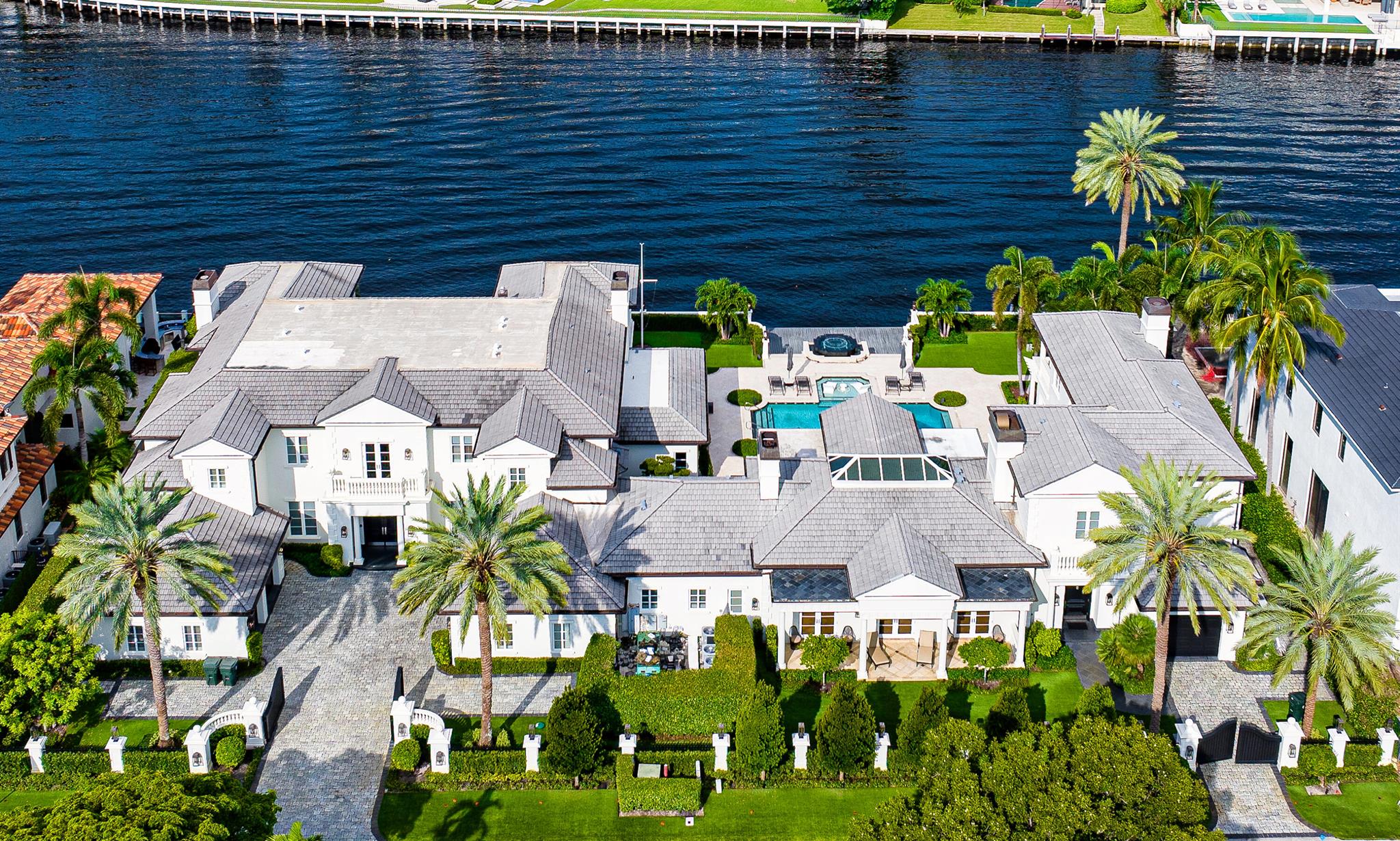 This Intracoastal Compound residing in The Estate Section, is approached on a gated cobblestone drive, surrounded by a pristine landscape complete with topiary and medjool date palms. From its dramatic two-story entry foyer with sweeping staircase to its gleaming patterned stone and ebony-stained hardwood floors, custom moldings and fireplaces, 11'+ ceilings, waterfront balconies and glorious waterway views from all the major rooms, every aspect of this superbly furnished residence speaks to gracious living with modern style and flair. DISCLAIMER: Information published or otherwise provided by the listing company and its representatives including but not limited to prices, measurements, square footages, lot sizes, calculations, statistics, and videos are deemed reliable but are not guaranteed and are subject to errors, omissions or changes without notice. All such information should be independently verified by any prospective purchaser or seller. Parties should perform their own due diligence to verify such information prior to a sale or listing. Listing company expressly disclaims any warranty or representation regarding such information. Prices published are either list price, sold price, and/or last asking price. The listing company participates in the Multiple Listing Service and IDX. The properties published as listed and sold are not necessarily exclusive to listing company and may be listed or have sold with other members of the Multiple Listing Service. Transactions where listing company represented both buyers and sellers are calculated as two sales. The listing company's marketplace is all of the following: Vero Beach, Town of Orchid, Indian River Shores, Town of Palm Beach, West Palm Beach, Manalapan Beach, Point Manalapan, Hypoluxo Island, Ocean Ridge, Gulf Stream, Delray Beach, Highland Beach, Boca Raton, East Deerfield Beach, Hillsboro Beach, Hillsboro Shores, East Pompano Beach, Lighthouse Point, Sea Ranch Lakes and Fort Lauderdale. Cooperating brokers are advised that in the event of a Buyer default, no financial fees will be paid to a cooperating Broker on the Deposits retained by the Seller. No financial fees will be paid to any cooperating broker until title passes or upon actual commencement of a lease. Some affiliations may not be applicable to certain geographic areas. If your property is currently listed with another broker, please disregard any solicitation for services. Copyright 2023 by the listing company. All Rights Reserved.