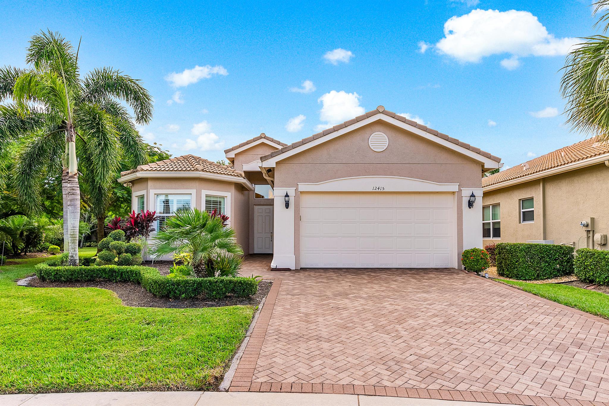 This beautifully appointed Bimini model has a popular open floor plan.The 3/3+den sits in a cul-de-sac on a lushly landscaped,private,oversized (almost 1/3 acre) pie-shaped home site.Features include impact windows,new a/c unit,central vac,designer window treatments,plantation shutters,magnificent light fixtures,fans,hi-hats and upgraded baths!Porcelain tile has been installed on the diagonal in the main living areas.The gourmet kitchen has wood cabinets,granite countertops,glass tile backsplash,snack bar with pendant lights,breakfast area and much more!The double oven has convection cooking.The kitchen is open to the dining room and to the great room with built-in entertainment center.Large master suite with luxurious bath.You'll love the L-Shaped covered patio and large private lot.
