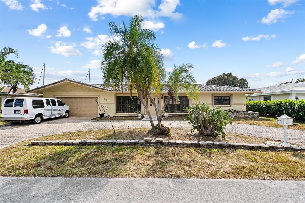 Amazing location in the highly sought after neighborhood of Venetian Isles. This property has tons of potential. Plenty of space to build your dream home or rehab the existing structure for around $500k makes it a new home. 3000+ square foot pool home is a boaters dream with NO FIXED BRIDGES, 90 feet of waterfront, 20-30 minute boat ride to either Hillsboro Inlet or Boca Inlet. Located across the canal from the Yacht Club where $4 million townhomes are being built along with a complete remodel of the Yacht Club. Investors Dream! Current owner is putting plans together that will sell with the property or the current owner can complete the remodel for a buyer at an agreed upon price.