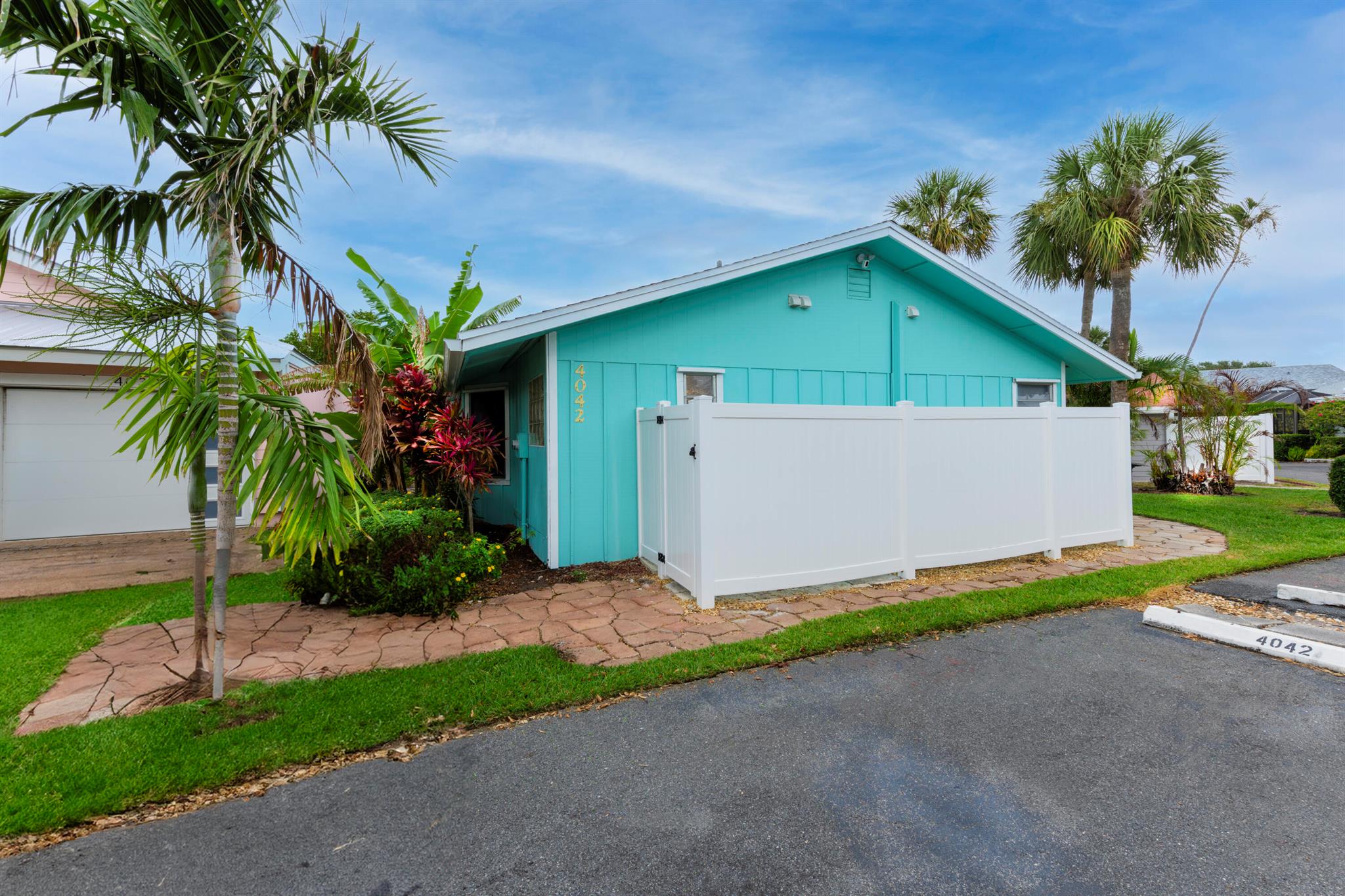 Welcome to the serene Indian River Point situated in the historic and quaint seaside town of Jensen Beach. This charming turnkey home is meticulously prepared to serve as your year-round residence or a seasonal getaway. Additionally, it presents a unique opportunity for Airbnb hosting, boasting generous income potential.  Nestled between the mangroves of the Indian River Lagoon and within walking distance to the beach, this community offers an array of amenities, including boating facilities with available slips for rent or purchase, a pool, and tennis courts--all conveniently located along the intracoastal waterway.  The property is available with optional furnishings for purchase, providing an effortless transition into your new home. Noteworthy features include a recently
