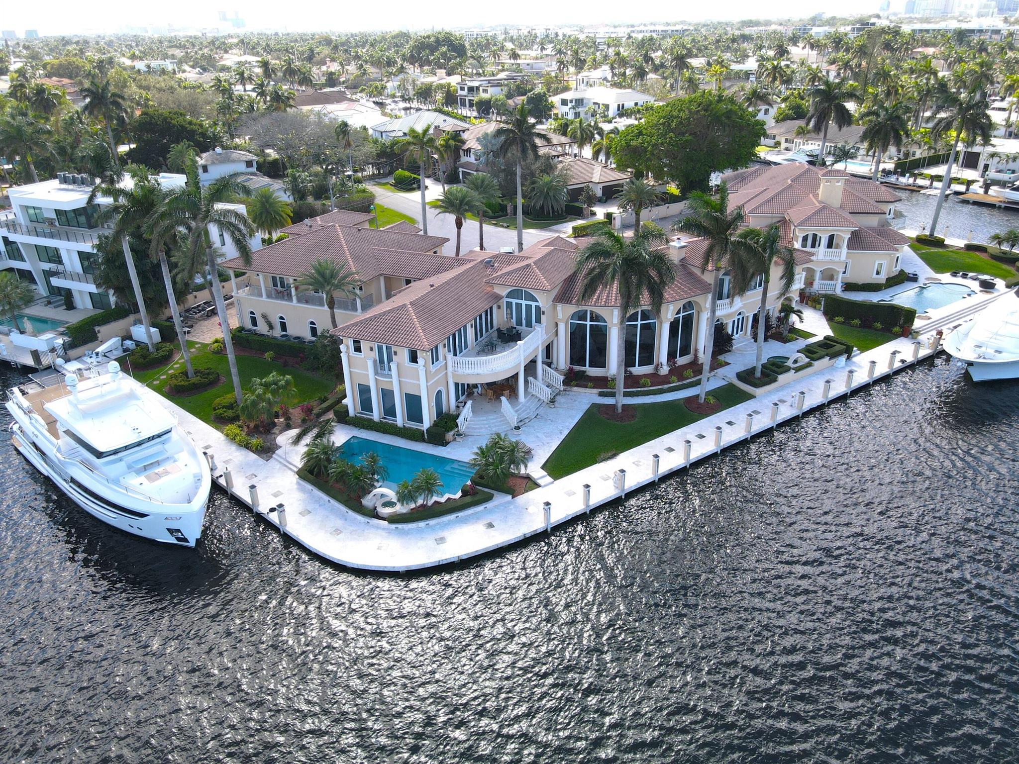 Experience the pinnacle of waterfront luxury with this exceptional point lot, boasting breathtaking views of the Rio Barcelona Canal and the Intracoastal. Nestled in the prestigious 'AAAA' location of Seven Isles, this extraordinary ultra-high-end water viewpoint lot is a blank canvas for your architectural masterpiece. Immerse yourself in a world of endless design possibilities, all within an exclusive, 24/7 security-patrolled community. This property features an 8 bedroom, 8 bathroom residence, complete with a full house generator, a unique 4,500 lb hydraulic deck crane, and an impressive 320 ft of water frontage. Embrace this rare opportunity to craft a generational legacy of opulence and luxury. Stay tuned for professional photos that will further highlight this unparalleled offering.