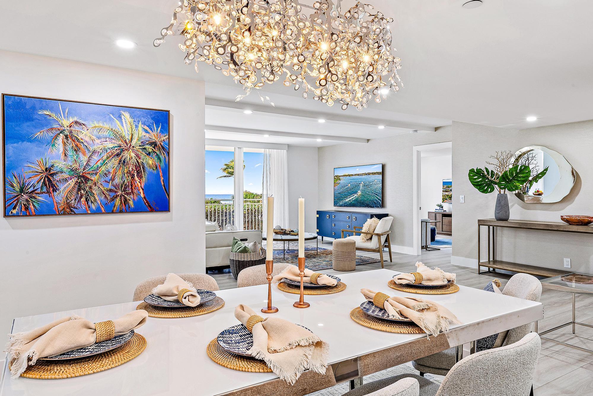 This PROFESSIONALLY REDESIGNED + RENOVATED 2 BR/2 BA LUXURY OCEAN CONDO is a ''one of a kind'' coastal home. Enjoy CUSTOM KITCHEN with high end finishes and appliances, MARBLE SPA BATHS + SLEEK BUILT-IN'S,  top of the line LVP FLOORS, a BOXED BEAM CEILING w/integrated LED lighting, PGT IMPACT WINDOWS/DOORS, ample storage, FORMAL DINING, GORGEOUS VIEWS and HIGH EFFICIENCY AC. Brigadoon is one of the ''LOWEST PER SF BEACH CONDOS'' in prime condition, already structurally certified + fully reserved. The 2 bldg, 96 unit complex features: GARAGE PARKING, DEDICATED BEACH access, heated pool, clubhouse, cabanas on the green, fitness center w/saunas. Location is ideal...walking distance to the Juno Beach Pier, the Jupiter Dog Park, dining + shops and only 20 minutes to PBIA.
