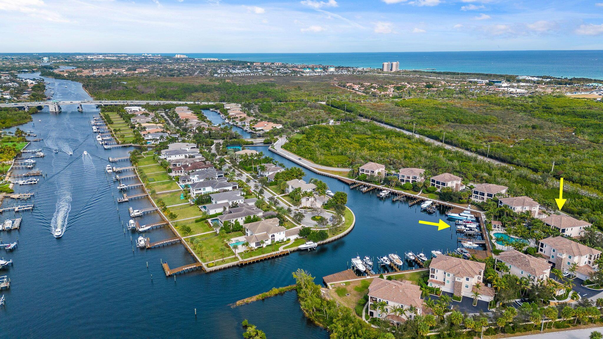 A luxury property in a premier location. Elegant 3-bedroom condo in exclusive Frenchman's Harbor. A gated, waterfront community, Frenchman's Harbor affords owners direct Intracoastal access, deep water slips, and no fixed bridges to the ocean. This property includes a deeded 45-foot boat slip. The home itself features an efficient, airy floorplan with a large, open chef's kitchen. Wood floors, custom trim, custom built-ins, high ceilings, and appealing colors give this unit a bright, coastal feel. Oversized balcony offers canal, pool, Intracoastal and sunset views. The best of condo and single family living with a private 2 car garage and plenty of driveway space. Unit is accessible with staircase and elevator options. Full hurricane impact windows and doors.