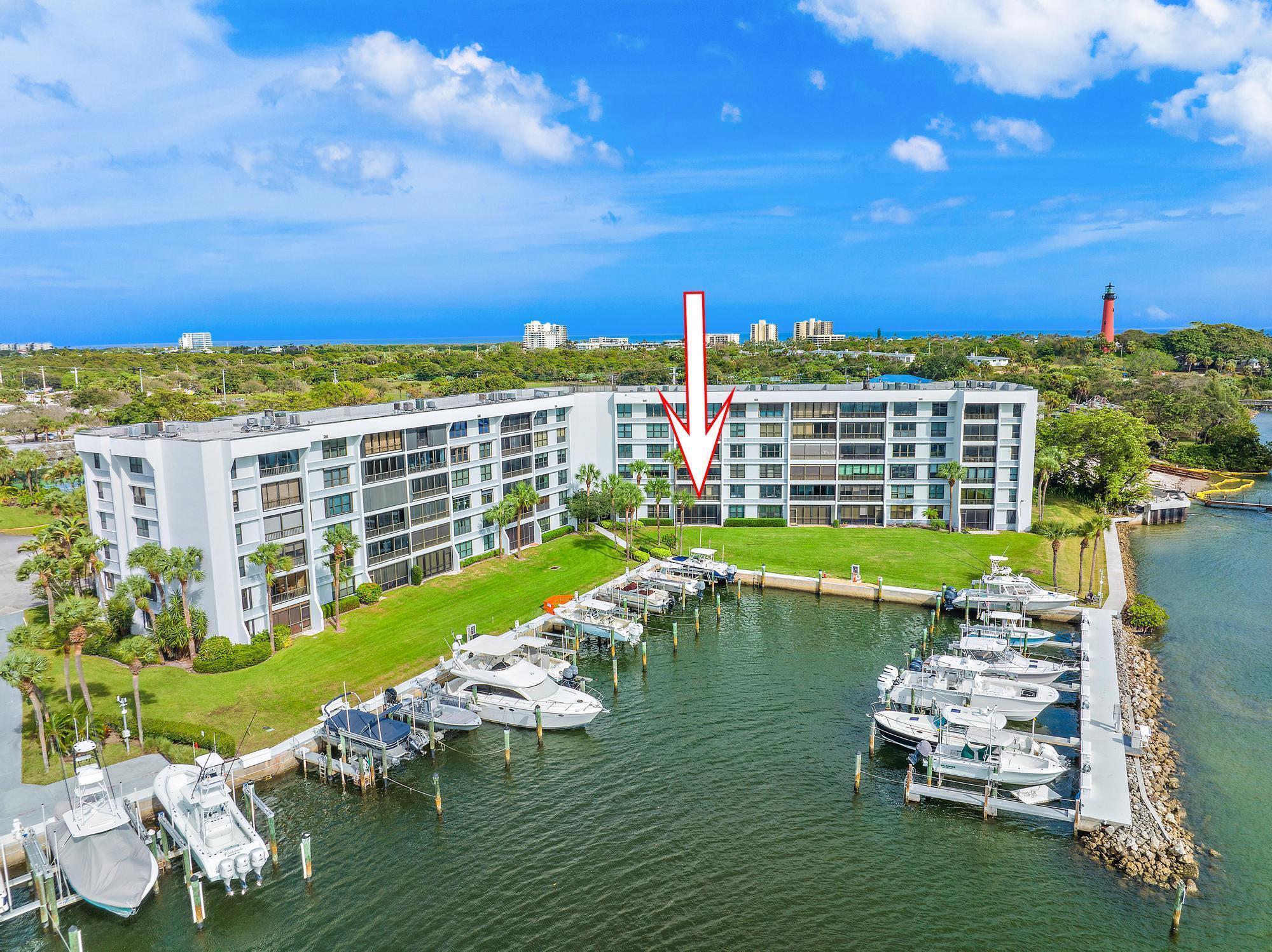 Enjoy amazing views of Jupiter Inlet and the Intracoastal from your new waterfront home in Jupiter Cove, where the Loxahatchee River, Jupiter Inlet and Intracoastal all converge offering easy access to the Atlantic Ocean. Step out the back door to your private marina, or simply relax and enjoy sunset views from your porch. Ground floor unit updated with beachy neutral colors, Luxury Vinyl Plank flooring, and brand new appliances. New A/C and Water Heater in 2022..Jupiter Cove offers a marina with up to 40' boat slips available for rent or purchase when available, tennis, Pickleball, gated security, onsite management, kayak storage, a clubhouse and swimming pool. Check out the waterfront Tiki Bar with grilling and a private beach perfect for wading to the sandbar.