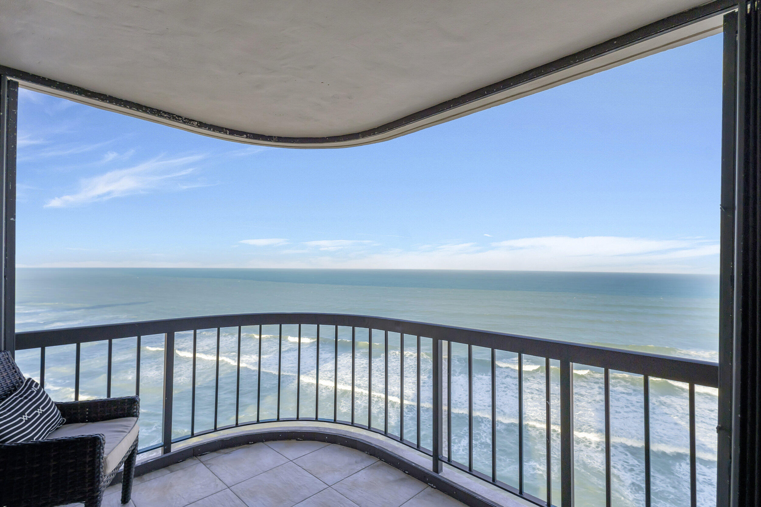 THE MOST GORGEOUS VIEW OF THE BLUE ATLANTIC OCEAN  FROM BOTH OF YOUR WRAP AROUND BALCONIES  DIRECTLY OVER THE OCEAN.1 BALCONY FACES SE AND THE OTHER FACES NE. FLOOR TO  CEILING IMPACT WINDOWS, UPGRADED KITCHEN WITH ELEGANT FINE WOOD CABINETRY, AND 3 UPGRADED BATHROOMS MAKES THIS  3 BEDROOM 3 BATHROOM UNIT 1 OF A KIND.WASHER AND DRYER IN UNIT. GARAGE PARKING,HEATED POOL,JACUZZI , BBQ AREA, STATE OF THE ART FITNESS CENTER, HIS AND HERS SAUNA, BILLIARD ROOM, 24 HOUR CONCIERGE SERVICE, MANED SECURITY GUARD GATE, LIBRARY,  OCEAN LOUNGE WITH FULL KITCHEN, AND MOST IMPORTANT 700 FEET OF SANDY BEACH AT YOUR FOOTSTEPS.