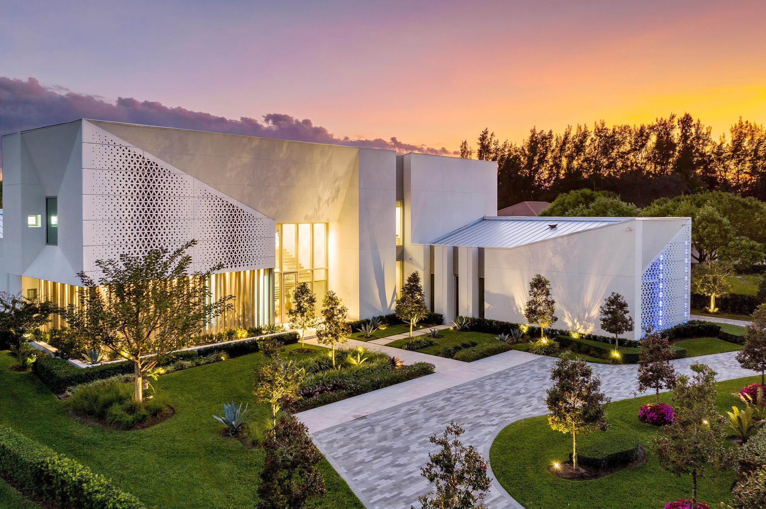Welcome to this one-of-a-kind modern sanctuary in the heart of Palm Beach Gardens! This ultra-luxury architectural build boasts 5 bd, 8 ba & 2 half ba situated on over 44,000 square feet of Japanese inspired landscaping. This estate offers all of the advancements of new-age construction with stainless steel panelized framing, glass elavator with custom painted wall and glass suspended staircase. Keep cool with insulated/laminated impact windows throughout and automized shades. The two-story property features imported rain showers, flushed Italian doors and top-of-the-line appliances. Entertain with 9 seat custom theatre and home gym. Overabundance of indoor/outdoor living with expansive backyard including a 75 ft infinity saltwater pool with glass canopy & folding impact window BBQ space