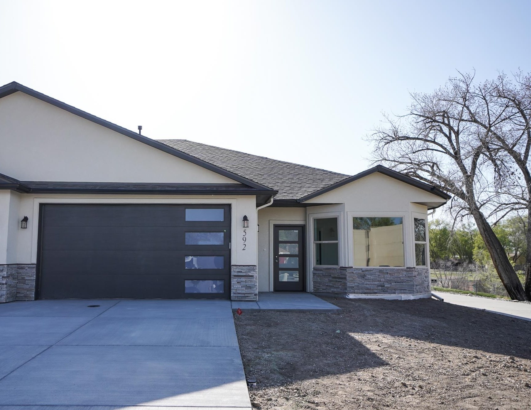 New construction in desirable Fruita. Lock and leave townhomes are fully landscaped and fenced, and the HOA maintains landscaping for just $75 per month. These townhomes are adjacent to a 22 mile paved walking path that connects with a state park and biking trails. The home includes a spacious granite island and open concept in the common space. The master en suite features a fully tiled shower with dual showerheads and a euro glass door. The second bedroom is highlighted by natural light from the front  Bay windows, and is adjacent to the full bathroom with a tiled shower and bathtub. Storage and built-in bench are abundant for a home of the size. The home is efficient with 2 x 6 construction and an excellent place to call home. Buyer to verify all information.