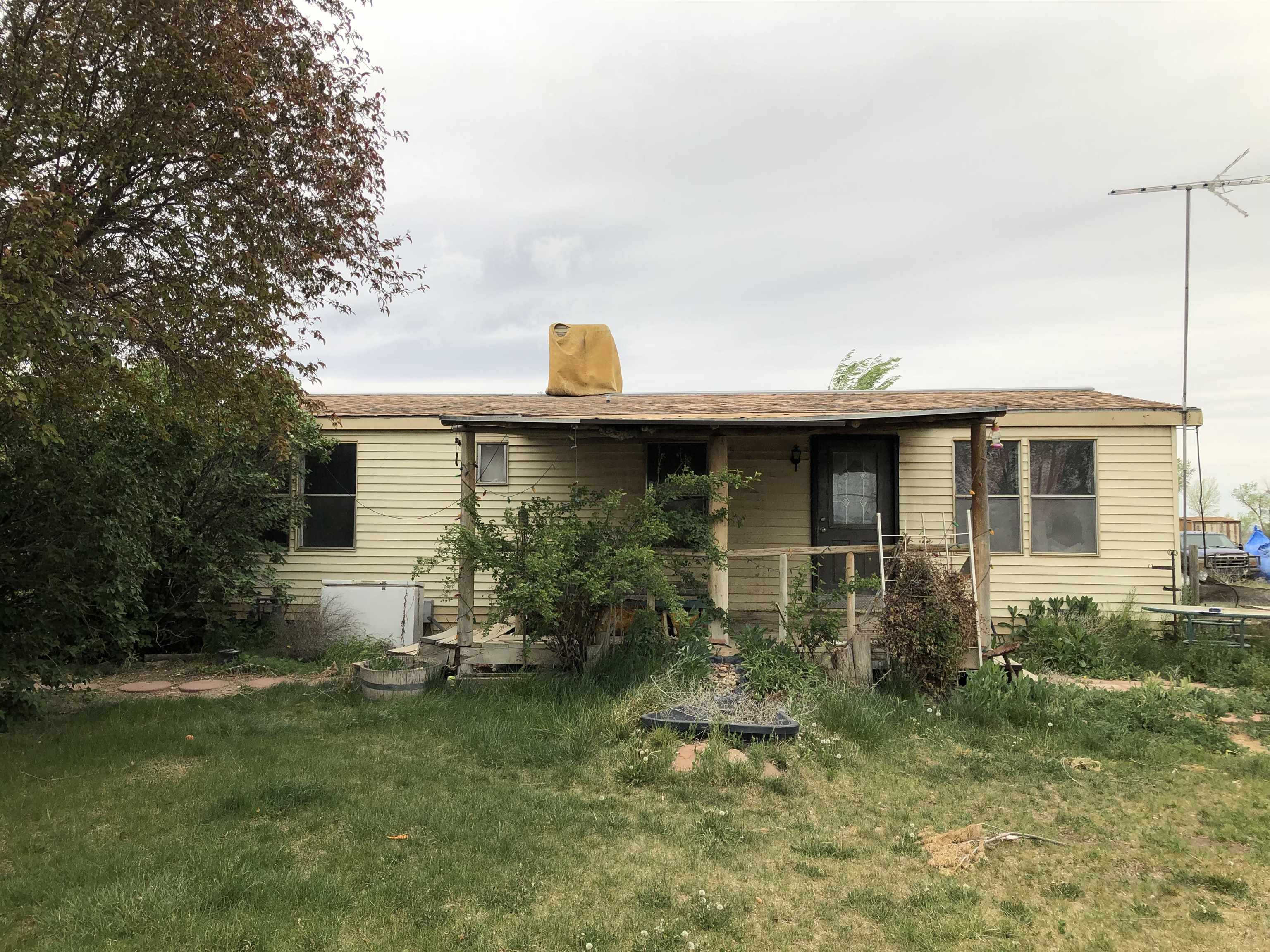 Come all investors! Over 3 acres currently zones residential, but all neighboring homes have been re-zoned to commercial, so possibilities are endless. Turn this property into your dream farm, with some TLC you can bring the whole family and have plenty of room.