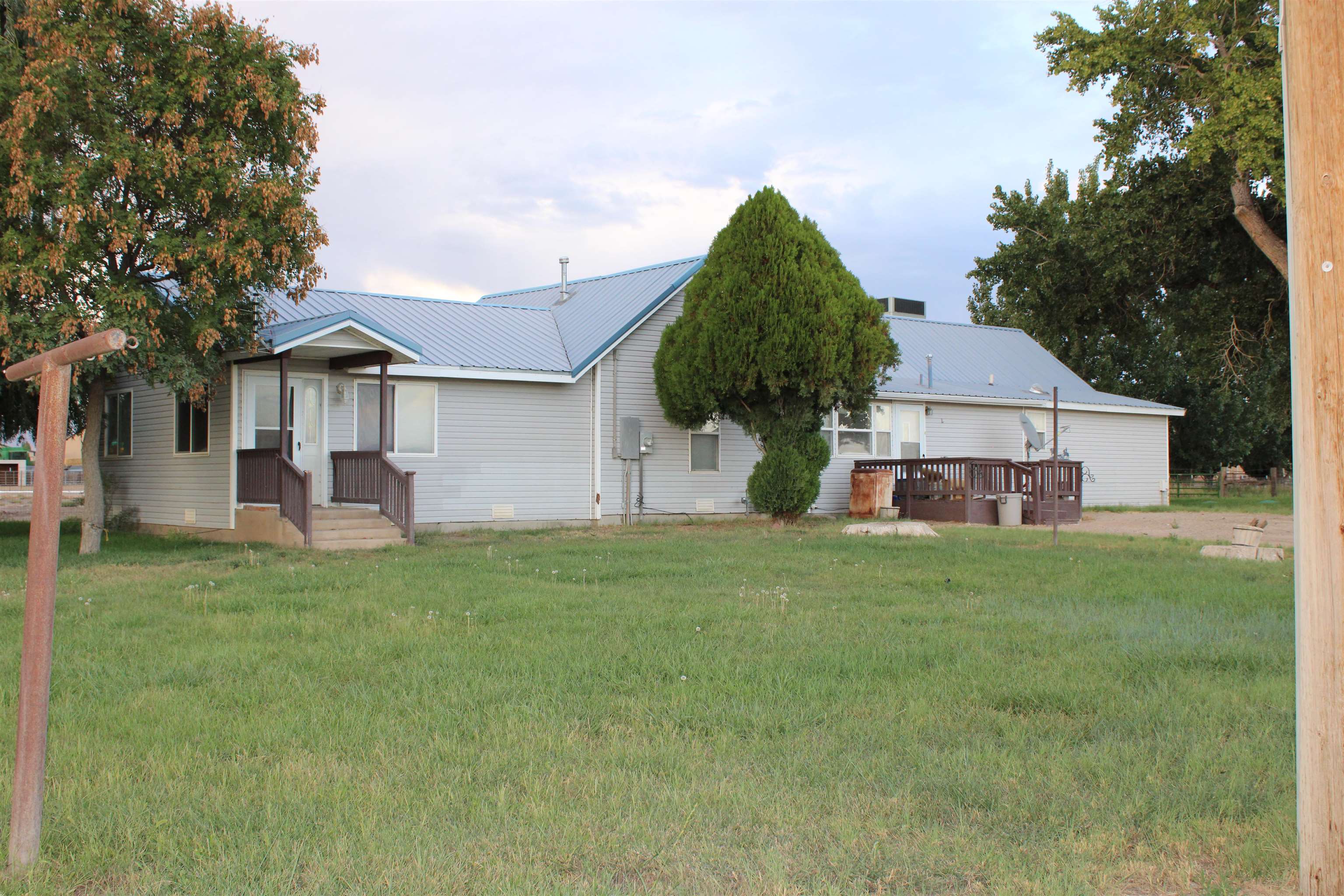 Come check out this place! Plenty of room for horses, RV's and everything in between! You will love the views of the Colorado National Monument and Mt. Garfield. Two water shares with Grand Valley Water Users. Master bedroom added in 2000. Pipes were replaced as well as a new HVAC system in 2020. New septic system in 2018. Own your own little slice of the country.