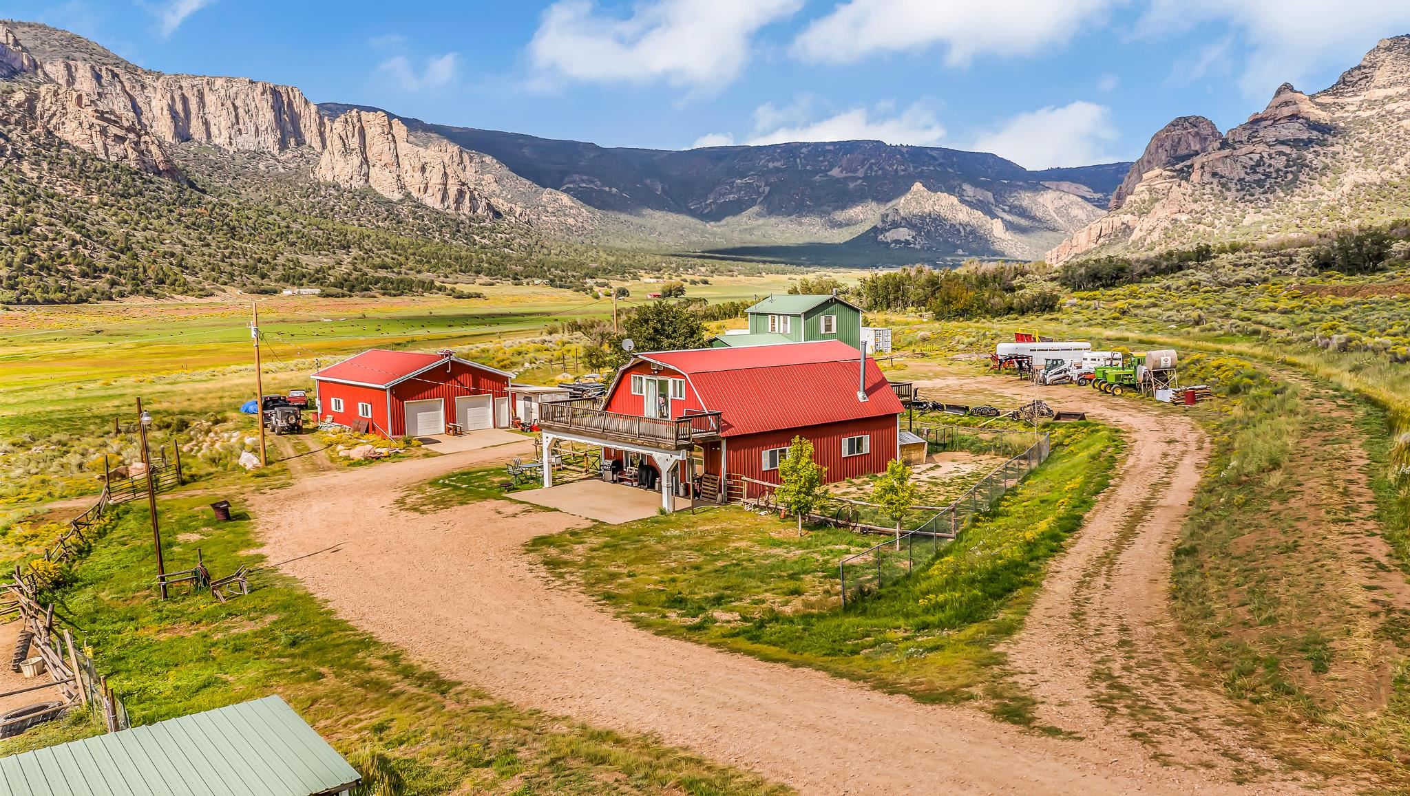 Open House Sunday April 16, 2023 11:00 am-2:00 pm. Want more acreage? Possibility of adding 27.65 ac lot and another lot with 32.18 Acres. All adjacent with total acreage of 199.68 if combined.  Breathtaking 360 degree Views, Area 61 Trophy ELk and Deer, Bear, Hunting Blinds, trails.Bring your outdoor toys. Grazing fields. Small Creek running through. Horse barn and corrals. Large 3 Bay Garage. Two Houses: a Primary home, and a Short-term Rental? Both Residences have their own Electric, Gas meter and Septic system, and they share a well.  Red Barn house: Very Rustic with Lots of Wood features and has 10 ft ceilings, tongue and groove wood planks on the ceiling and a massive kitchen with cupboards to the ceiling, plenty of extensive closets for storage upstairs. Two Second story decks one on each end of the house.Covered porch. New Water heater. Green House: has been completely remodeled with new kitchen, flooring and an extra large loft bedroom for complete privacy.