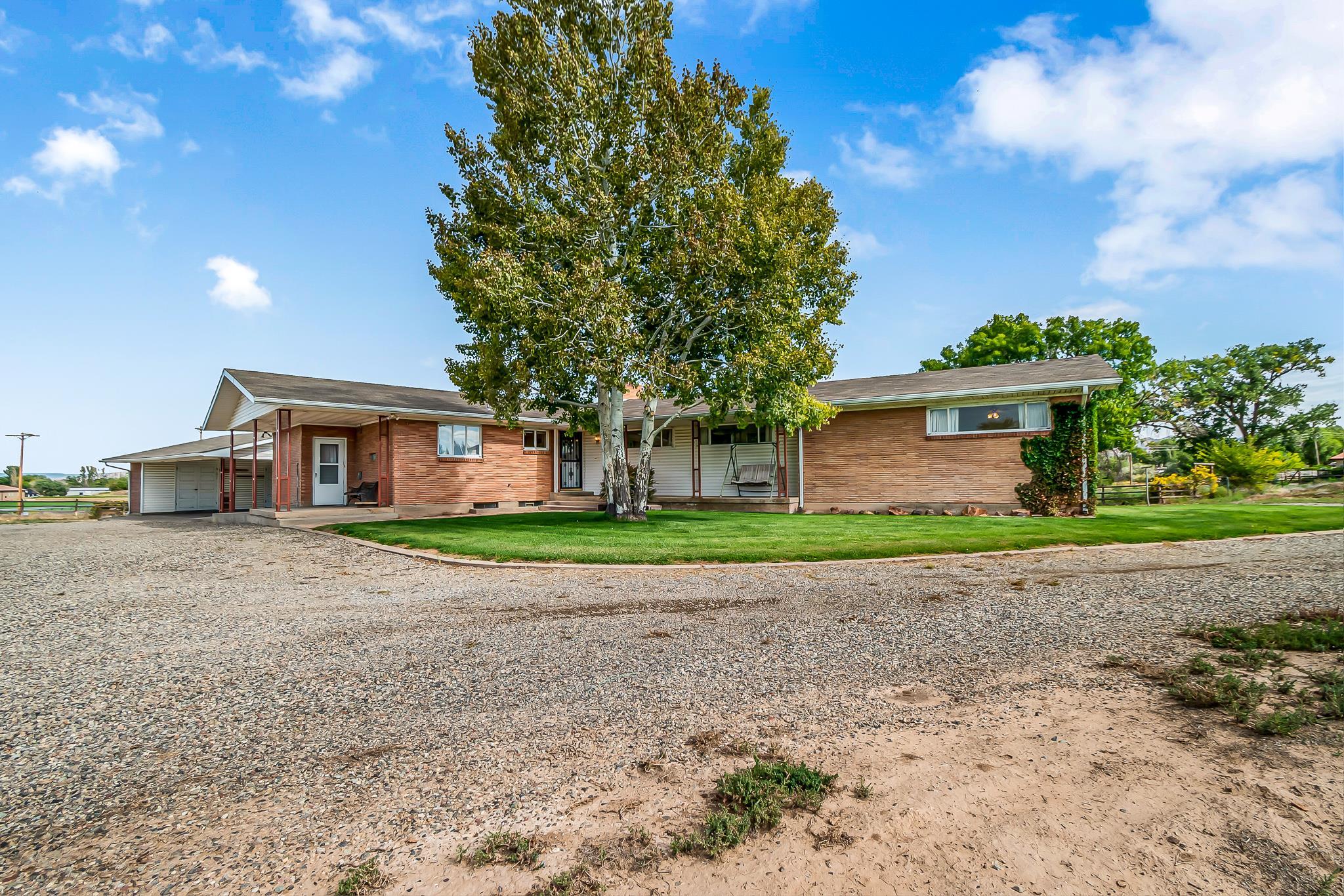 This is your chance to own small acreage with no HOA in North/Northwest Grand Junction. Right at 3 acres with a 2962 square foot home. Home has been meticulously cared for. There are 2 living spaces and an option for a mother-in-law set up in the walkout basement. Home has brand new roof, updated electrical, central air conditioning, newer septic system, and gorgeous views!!