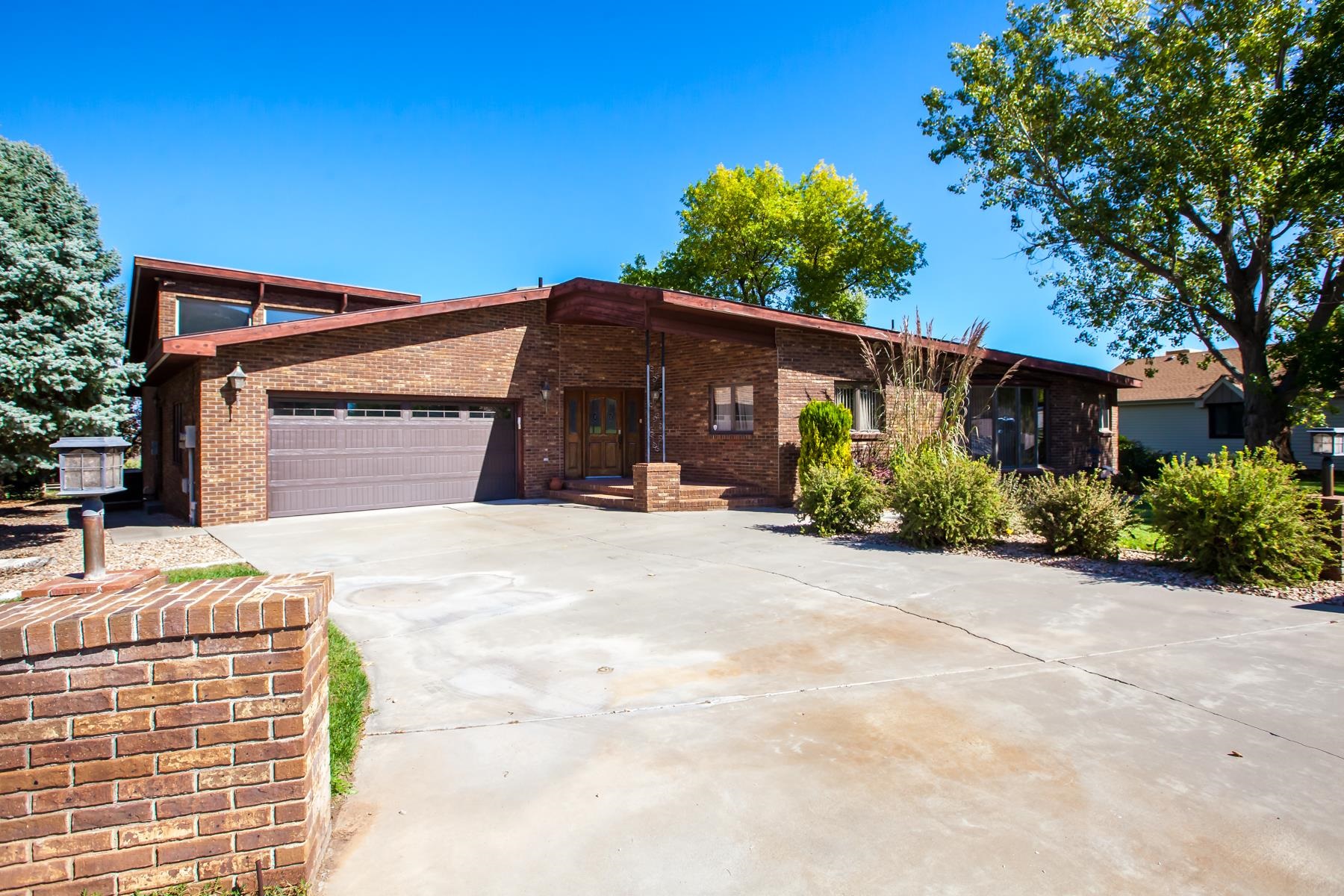 This quality built brick custom home boasts comfort and class with an opportunity to update a few things to reach it's full potential. Look out the large back windows onto the fairway of hole 6 at Tiara Rado Golf Course and see the city lights at night. Out the front windows you'll get views that are literally 'Monumental'. At just over 3,700 sq ft finished, there's potential to add even more finished space in the basement. Park the golf cart in the basement down a ramp with an overhead door. This property is close to hiking, biking and rafting opportunities while only being a few minutes from shopping, restaurants and other amenities. All furnishings can stay.   Laundry hook ups in upper lever bedroom as well.