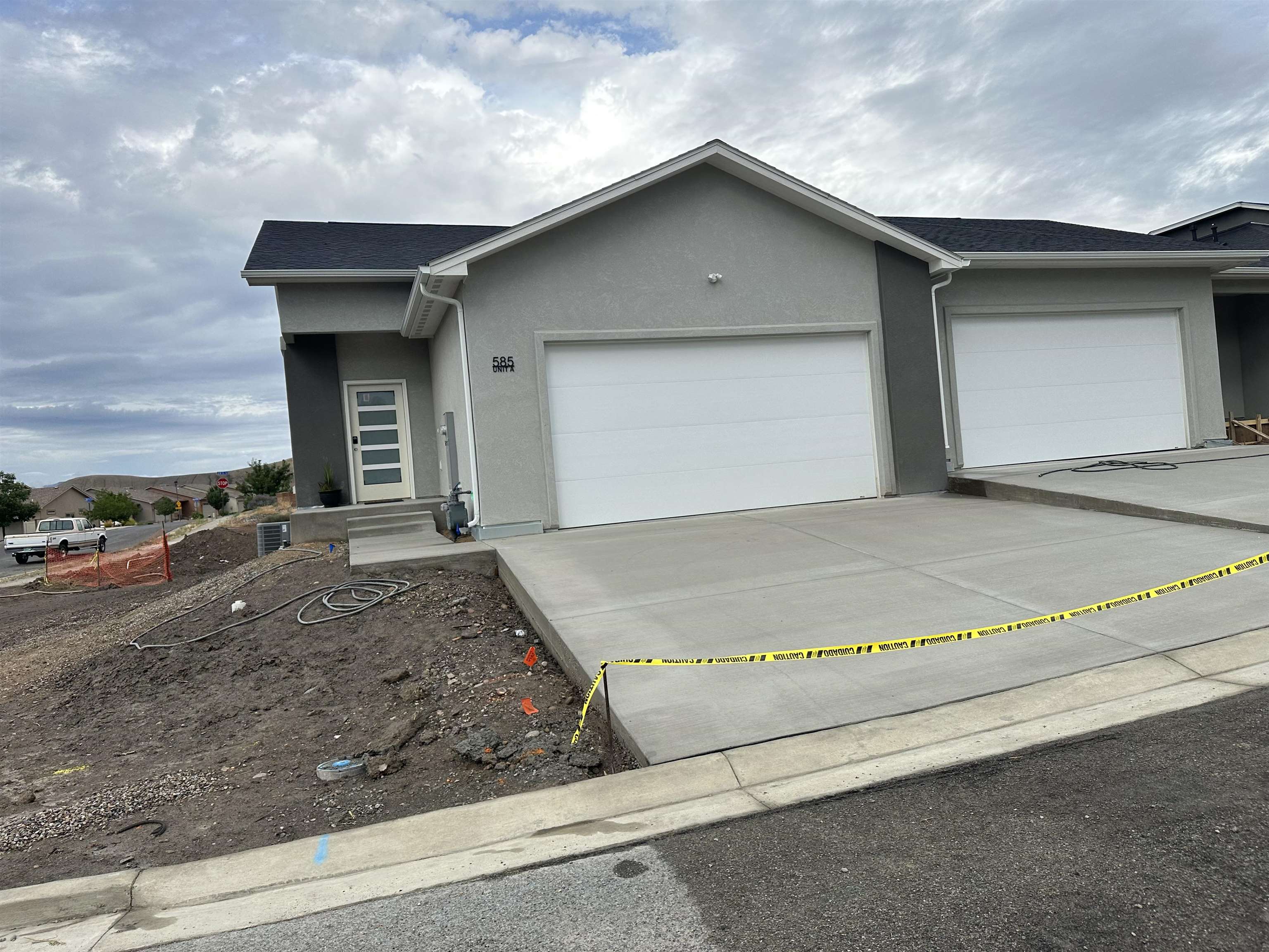 Brand New, Modern Style, 3 bedroom 2.5 bath, 2 car garage townhome, to be completed around  7/1/2023. Very stylish floor plan and quality finishes. High vaulted ceilings on main floor, 9' ceilings in walk out basement. Upper deck and lowered patio with privacy. Convenient 1/2 bath on main floor.  Granite Countertops with upgraded large single bowl kitchen sink. Central air, Luxury vinyl tile throughout with carpet in bedrooms and on stair treads and landings for comfort and safety. LED lighting throughout. Kitchen island seating and separate dining area. Stainless steel appliances. Ceiling fans in living room and each bedroom. Private covered front porch. Vinyl privacy fence in back perfect for those who are looking for a low maintenance or lock and leave home. HOA covers exterior maintenance, irrigation, and front landscape maintenance. Photos are of a different-finished townhome builder has built, but display similar finishes this townhome will have.   Listing price reflects a pre-completion price and will increase after units have been completed.  Builder is offering $10,000 in concessions towards interest rate buy down/ closing costs.  All information including but not limited to square footage, measurements, pricing, and availability are subject to change/error without notice. Buyer(s)to verify all.