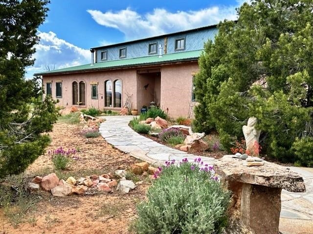 Sellers will consider all offers! Energy efficient straw bale stucco home on 39.80 wooded and rock outcrop acres. Custom home with hand poured adobe block that creates the unique interior walls and archways. Open floor plan, oriented passive solar windows as well as wood stove and propane stove to maximize the heating. Mini-split for cooling and heating as well. Wood planked vaulted ceilings with wood beams, custom doors, multi-colored quartzite flagstone throughout living areas and brick floors in the bedrooms and baths. 2 year old Stainless kitchen appliances, new hot water tank, new well pump for 5 GPM rated well, reliable internet and cell service! HOA maintained road, close proximity to McInnis Canyon and other public land! Views of sunsets, wildlife and starry skies. This is a must see! Buyers to verify all information